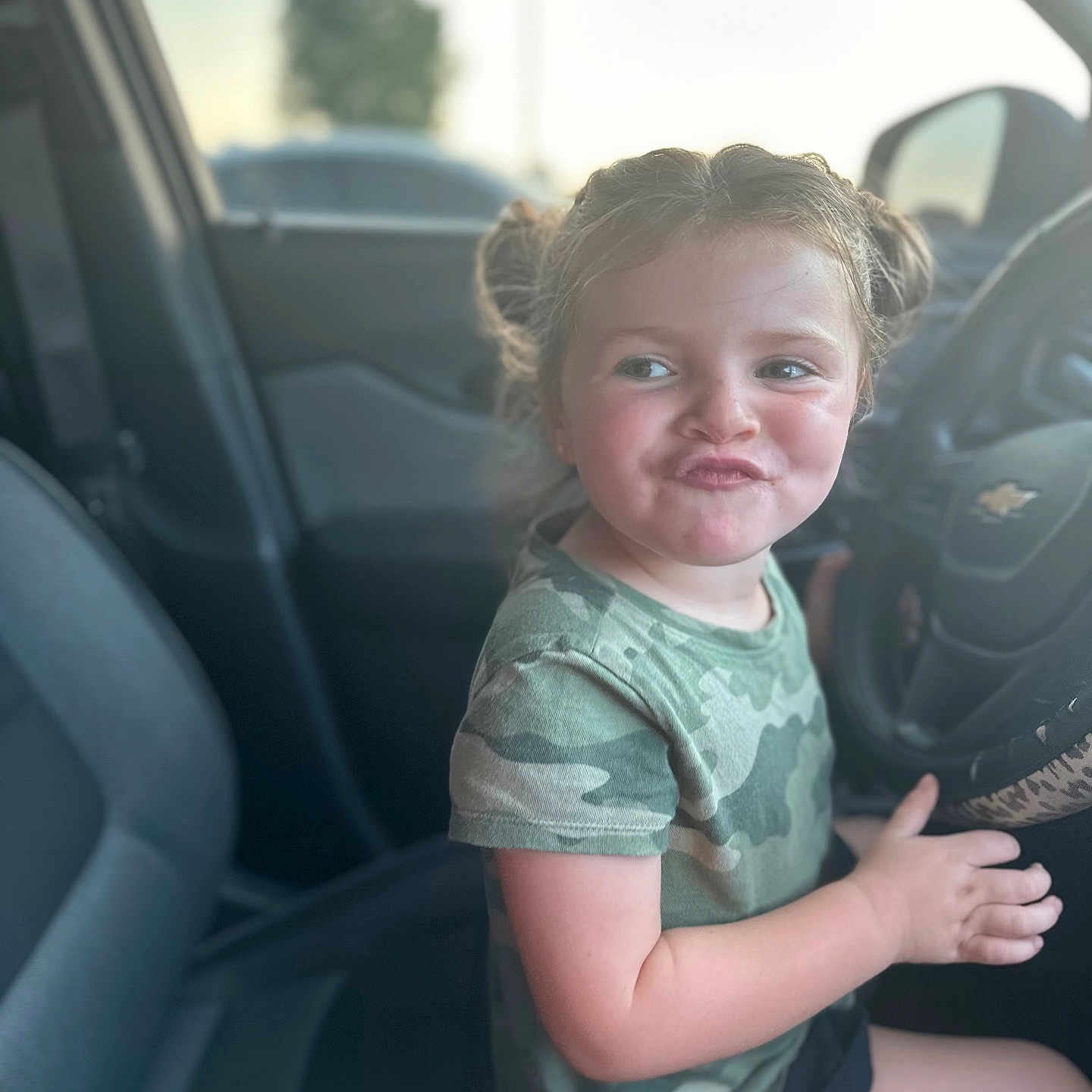 Graclynn joined the competition — help win amazing prizes! accessories, bodypart, car, child, clothing, face, female, finger, girl, hand, happy, head, person, photography, portrait, sitting, smile, t_shirt, transportation, vehicle