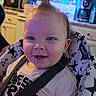 baby, child, smiling, mohawk, high_chair, straps, indoor, kitchen, face, blue_eyes, clothing, person, seat, patterned_fabric, happy, toddler, cute, expression, hair, infant