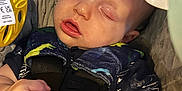 Joseph joined the competition — help win amazing prizes! baby, sleeping, car_seat, harness, blanket, toy, infant, child, face, hand, clothing, comfort, nap, soft_lighting, peaceful, cute, indoor, closeup, portrait, rest