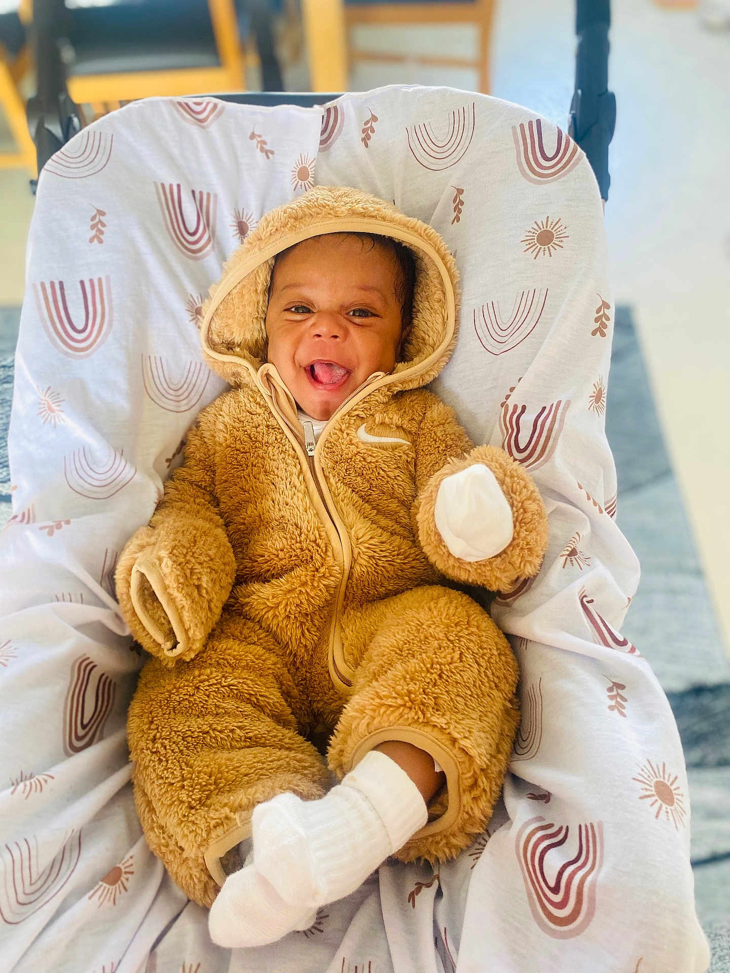 Samuela joined the competition — help win amazing prizes! baby, baby_boy, blanket, child, cozy, cute, cute_expression, fluffy_clothing, happy, hooded_jumpsuit, indoors, infant, onesie, patterned_blanket, portrait, seated, smiling, soft_texture, warm, white_socks