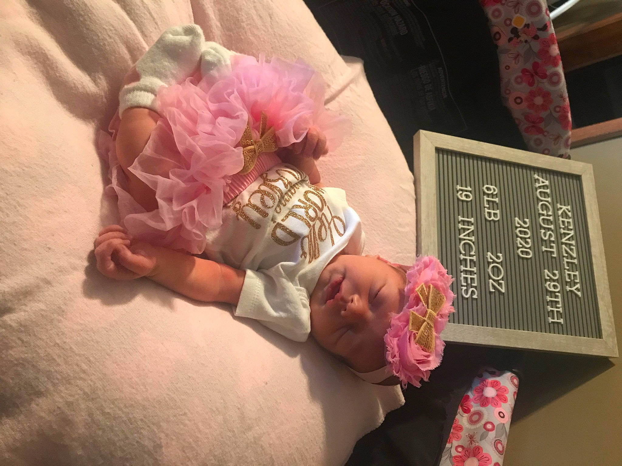 Kenzley joined the competition — help win amazing prizes! baby, birth, child, flower, headwear, nap, person, pink, plant, room