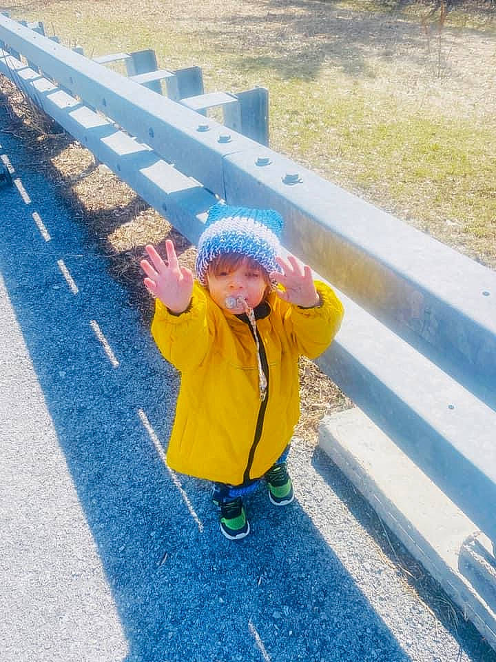 Evander is registered to the contest to win money with this photo: asphalt, cap, child, concrete, electric_blue, fence, fun, grass, hat, headgear, headwear, infrastructure, leisure, person, recreation, road, road_surface, sleeve, street_fashion, tar