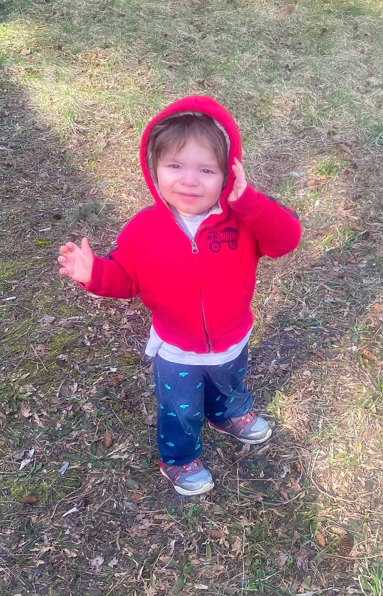 Crizman is registered to the contest to win money with this photo: baby_toddler_clothing, boot, child, electric_blue, face, fun, grass, happy, hood, hoodie, jacket, joy, landscape, people_in_nature, person, recreation, sleeve, smile, soil, toddler