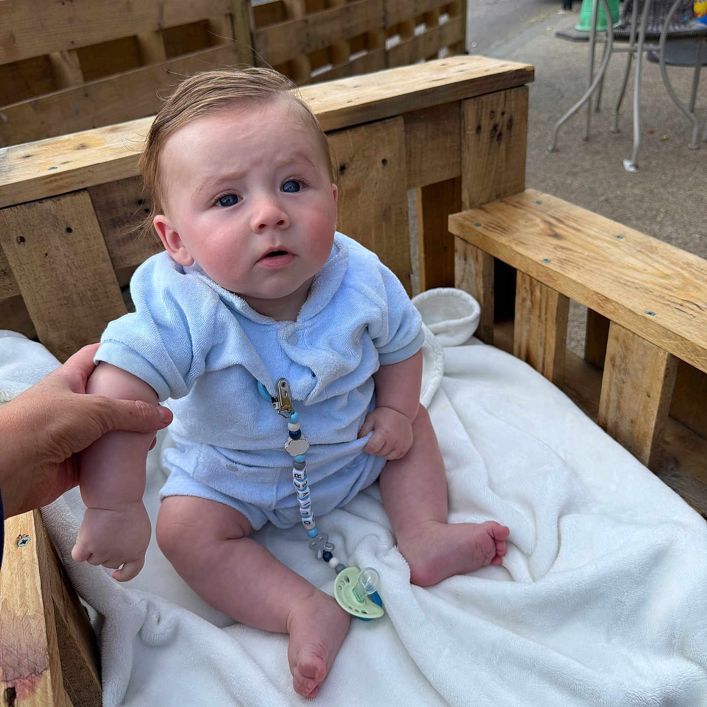 Oliver joined the competition — help win amazing prizes! baby, blanket, blue_clothing, casual, child, curious, daylight, expression, face, foot, hand, head, outdoor, pacifier, pacifier_clip, person, sitting, skin, support, wooden_bench