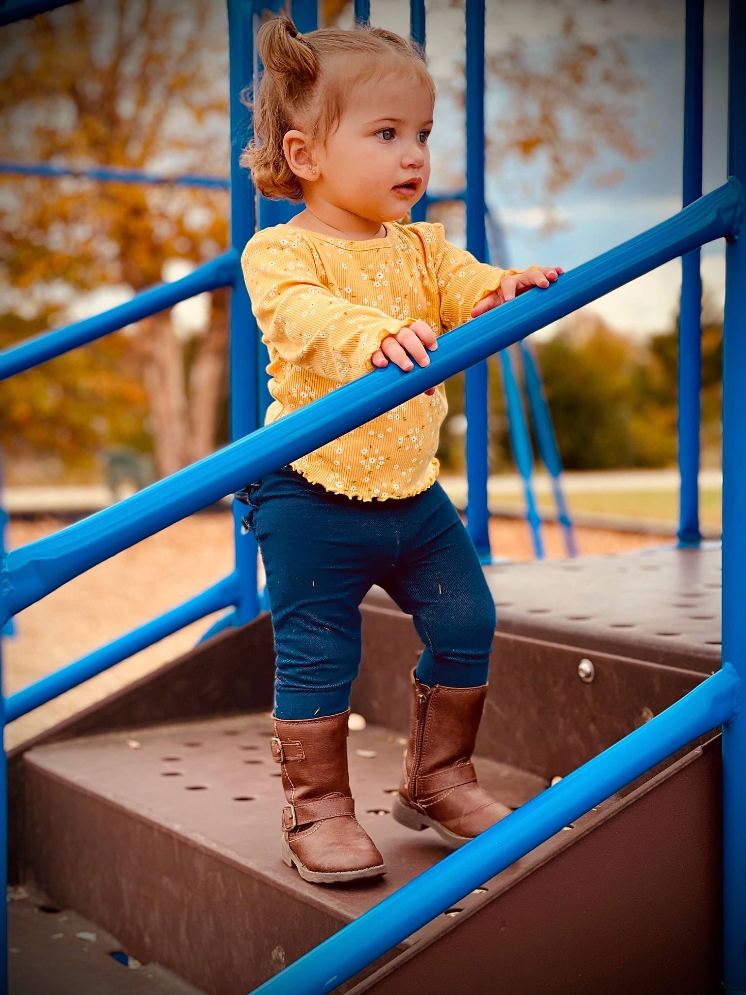 Nevaeh joined the competition — help win amazing prizes! baby, blue, child, city, clothing, electric_blue, flash_photography, fun, happy, leisure, outdoor_play_equipment, people_in_nature, person, playground, recreation, shorts, sitting, sky, sleeve, toddler