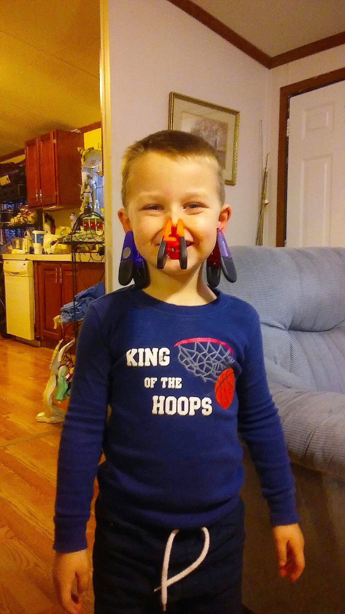 Will is registered to the contest to win money with this photo: arm, blue, child, clothing, cool, day, fun, girl, hair, hairstyle, human_body, joy, organ, outerwear, person, product, shoulder, smile, standing, t_shirt