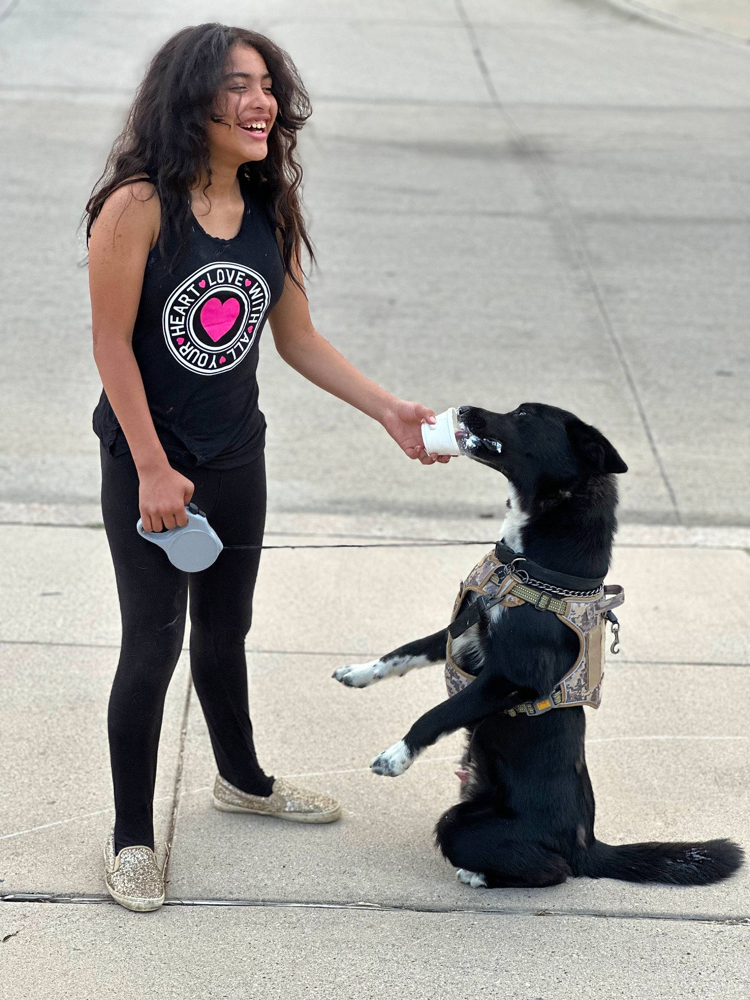 Kaylee is registered to the contest to win money with this photo: carnivore, companion_dog, dog, dog_breed, dog_collar, fashion_accessory, gesture, happy, human_leg, joy, knee, leash, leg, leggings, person, smile, spandex, sporting_group, sportswear, t_shirt