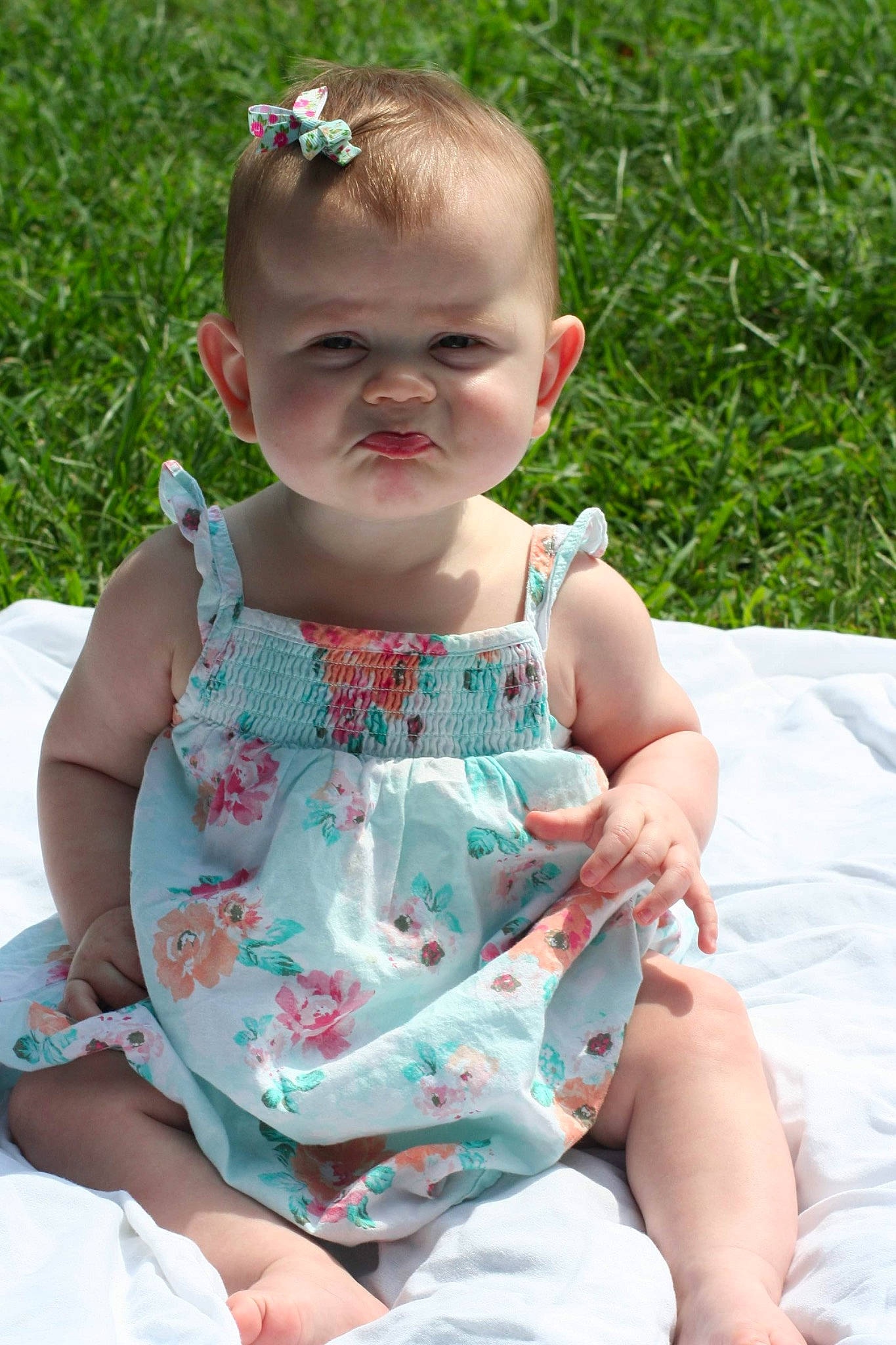 Brynleigh is registered to the contest to win money with this photo: baby, baby_products, baby_toddler_clothing, child, face, fun, grass, happy, head, leisure, pattern, person, pink, plant, product, sitting, skin, toddler, vacation