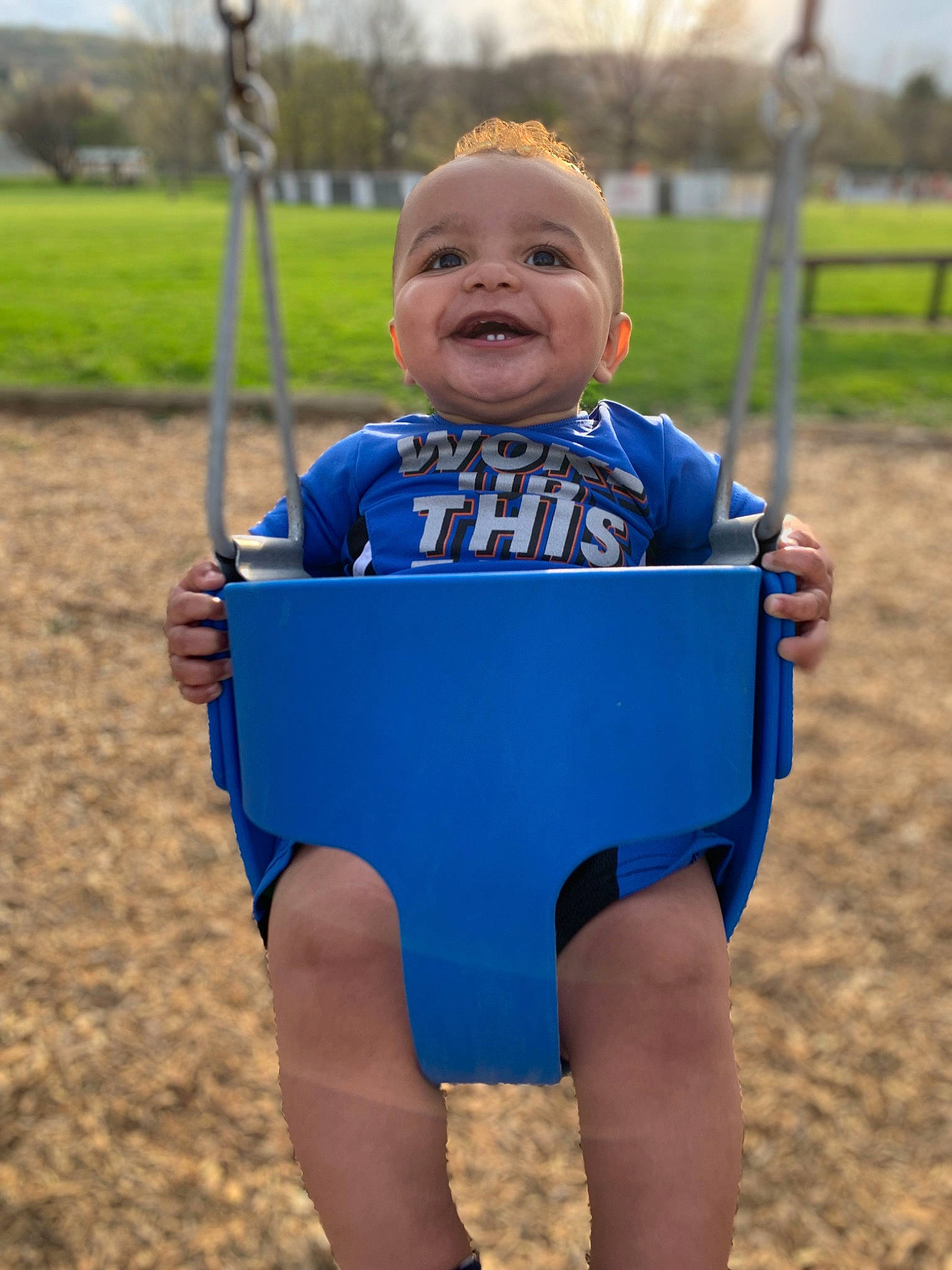 Kamdyn joined the competition — help win amazing prizes! baby_toddler_clothing, fun, grass, happy, head, human_body, joy, leisure, outdoor_play_equipment, people_in_nature, person, plant, playground, recreation, sky, sleeve, smile, summer, swing, t_shirt