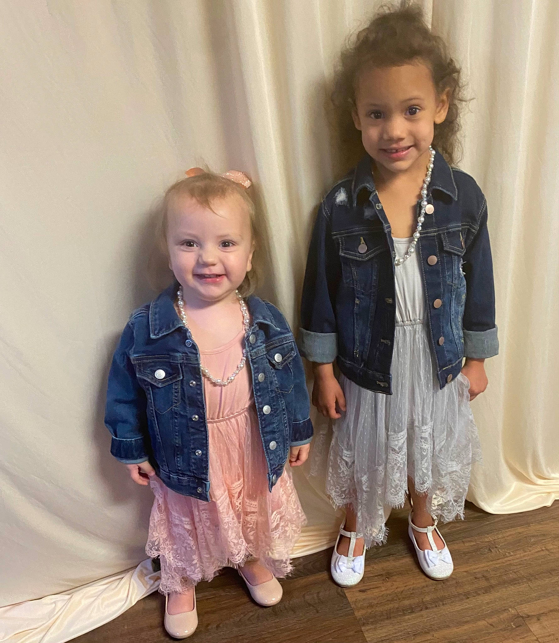 Adalyn Grace is registered to the contest to win money with this photo: baby_toddler_clothing, curtain, face, fashion_design, flooring, formal_wear, fun, gesture, hairstyle, happy, head, iris, joy, leg, person, shoe, shoulder, skin, sleeve, smile