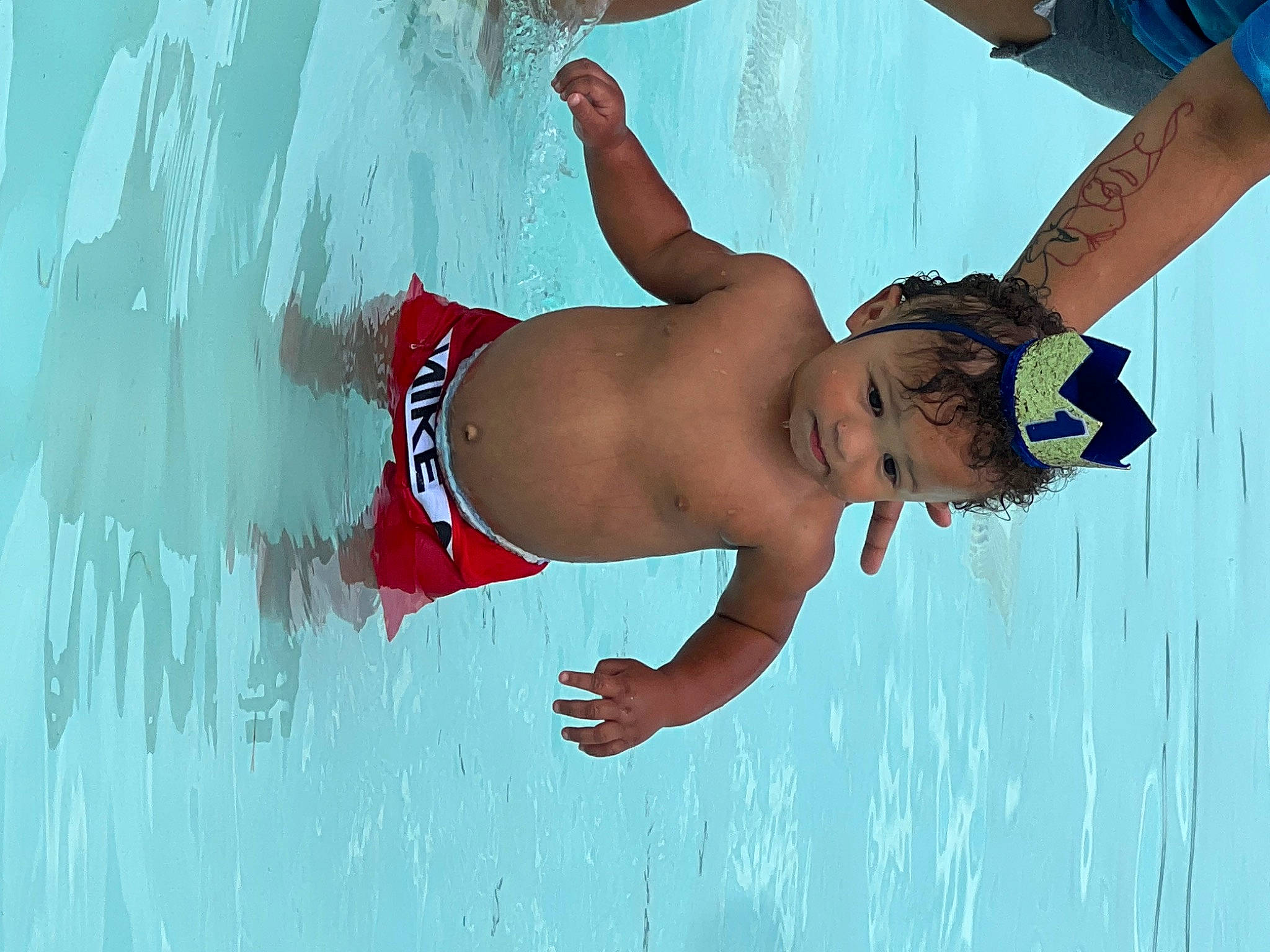 Jalen is registered to the contest to win money with this photo: abdomen, arm, azure, barefoot, chest, elbow, flash_photography, fun, gesture, happy, human_body, joint, leisure, people_in_nature, people_on_beach, person, recreation, swimwear, thigh, trunk