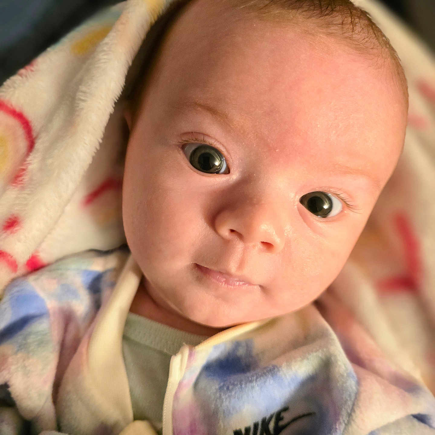 Hadlee Skye is registered to the contest to win money with this photo: baby, blanket, bodypart, clothing, face, finger, hand, happy, head, hoodie, knitwear, newborn, person, photography, portrait, quilt, smile, sweater, sweatshirt, towel