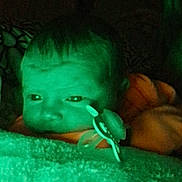 Chloe is registered to the contest to win money with this photo: baby, infant, child, face, eyes, pacifier, pacifier_clip, blanket, fuzzy_blanket, sleeping, bed, bedding, portrait, close_up, indoor, night, green_lighting, low_light, cozy, photograph
