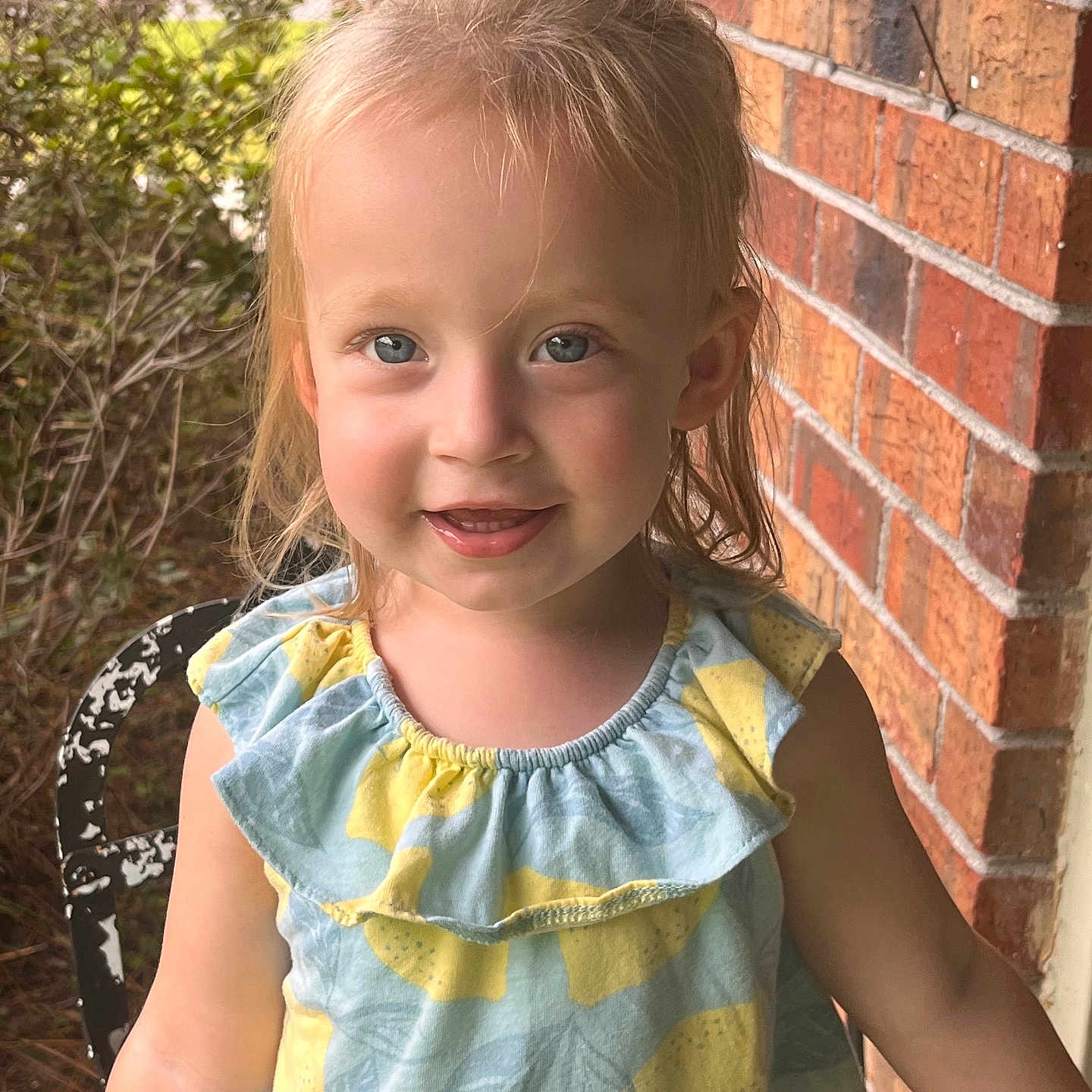 Charlotte joined the competition — help win amazing prizes! architecture, blonde, blouse, brick, building, child, city, clothing, dress, face, female, girl, hair, happy, head, person, photography, portrait, smile, wall
