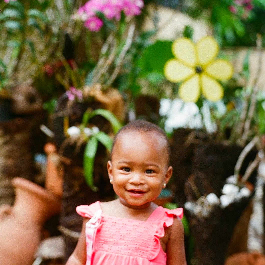 Amaya is registered to the contest to win money with this photo: child, face, female, flower, girl, happy, head, herbal, herbs, jar, person, petal, photography, plant, planter, portrait, pottedplant, pottery, smile, vase