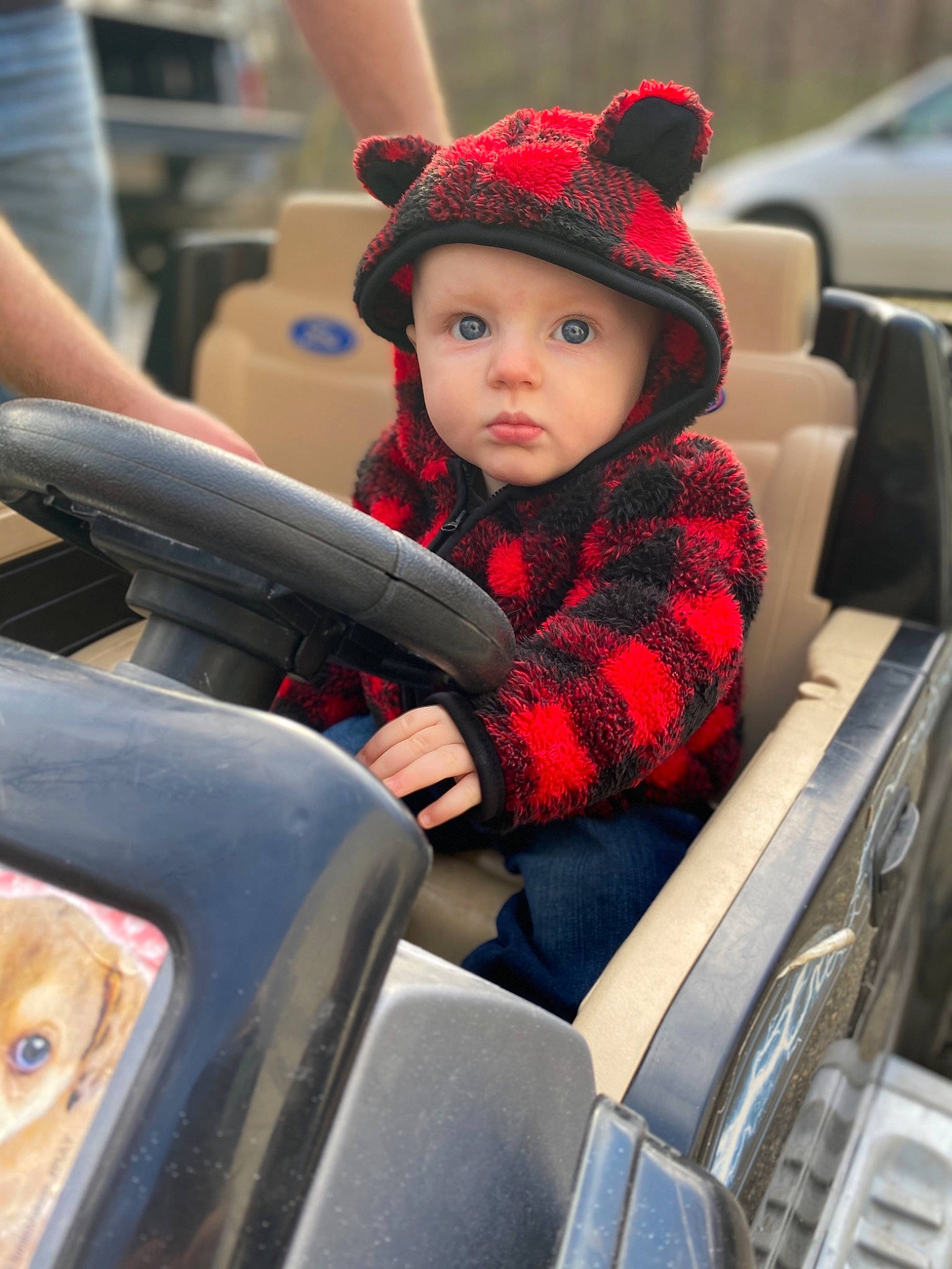 Brantley is registered to the contest to win money with this photo: car, child, headwear, person, plant, steering_wheel, toddler, vacation, vehicle