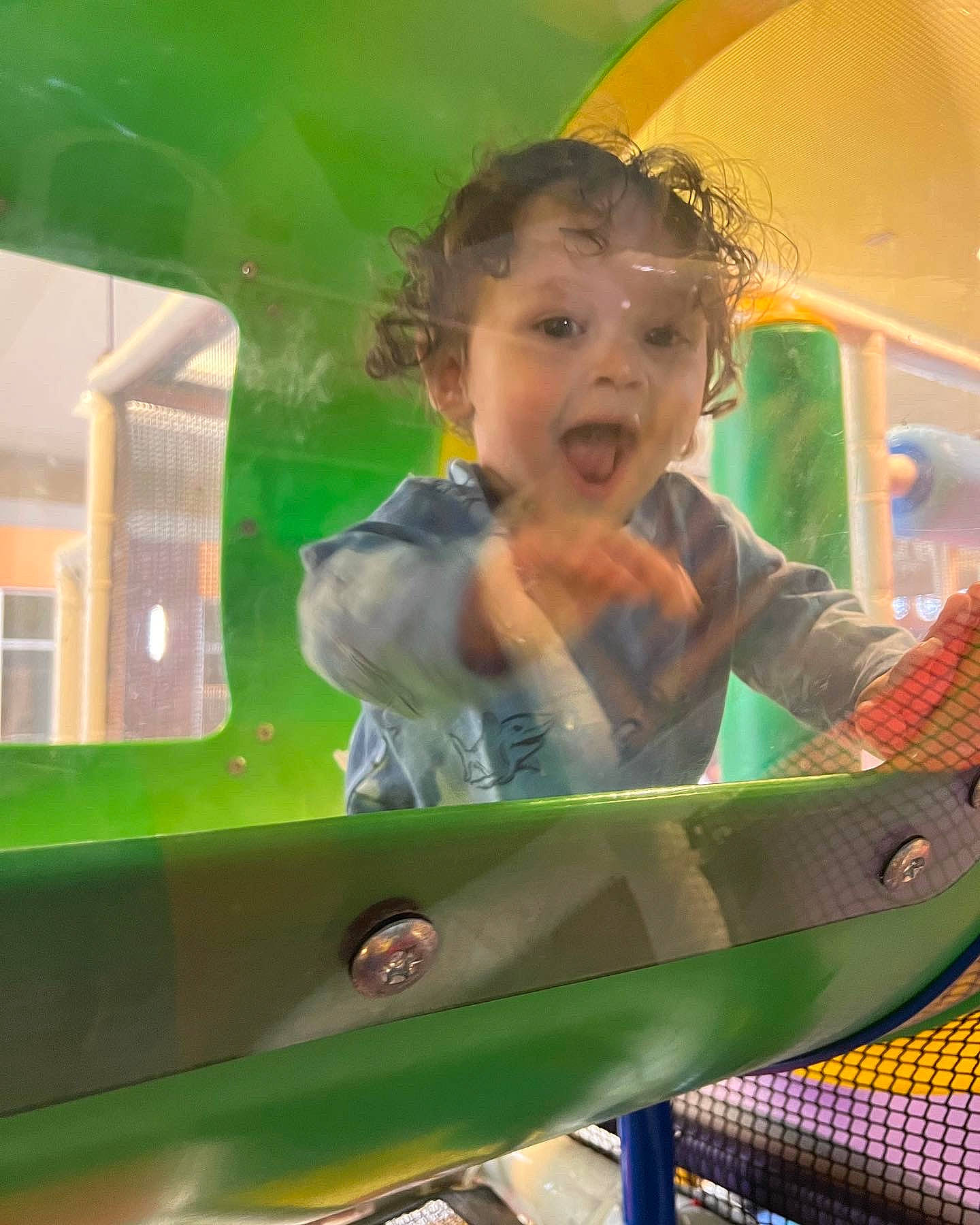 Brendan is registered to the contest to win money with this photo: amusement_park, amusement_ride, baby, baby_products, baby_safety, child, city, facial_expression, fun, hairstyle, happy, leisure, nonbuilding_structure, outdoor_play_equipment, person, play, recreation, room, toddler, toy