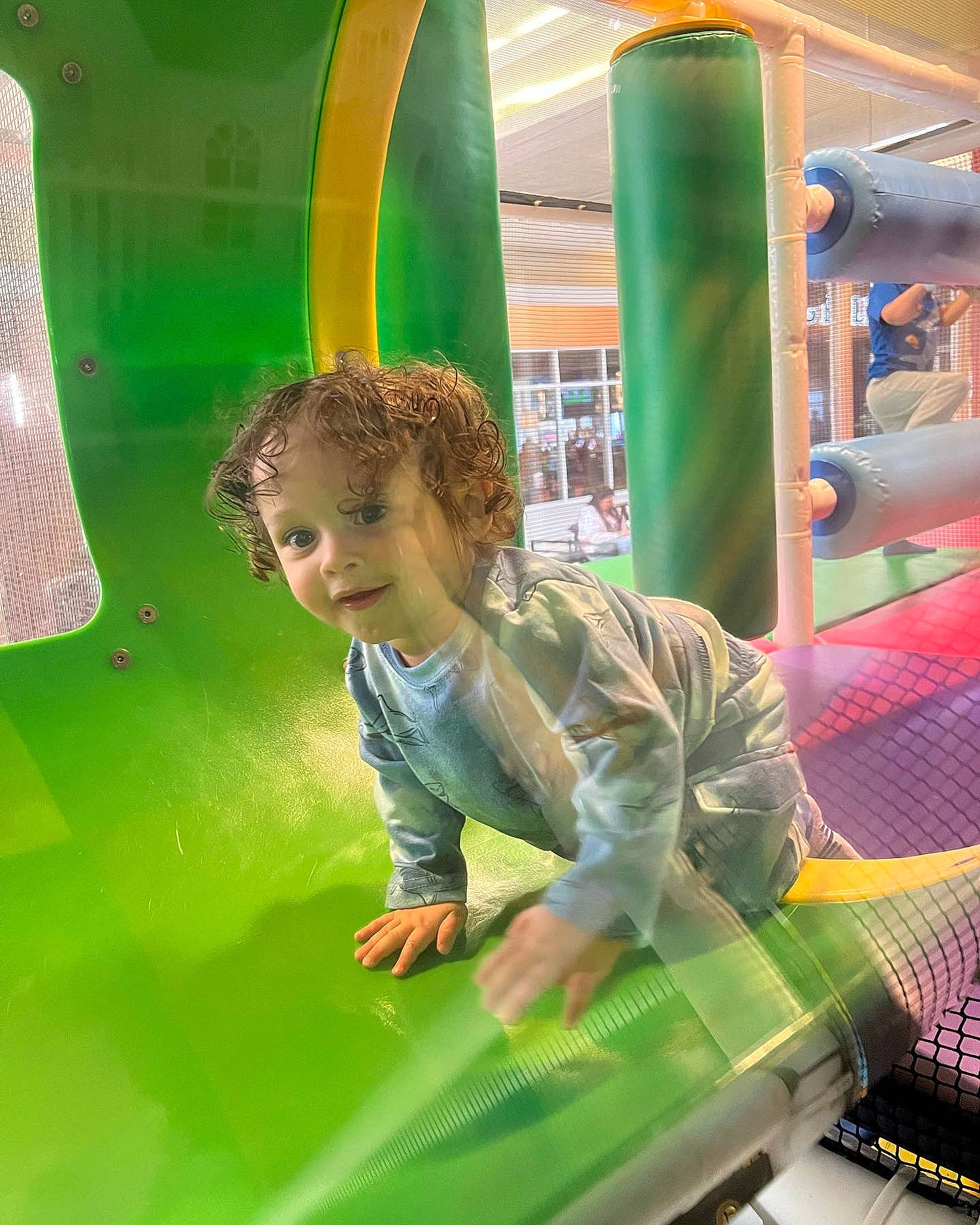 Brendan is registered to the contest to win money with this photo: child, chute, city, fun, games, grass, green, leisure, motor_vehicle, outdoor_play_equipment, person, play, playground, playground_slide, public_space, recreation, smile, snapshot, t_shirt, toddler