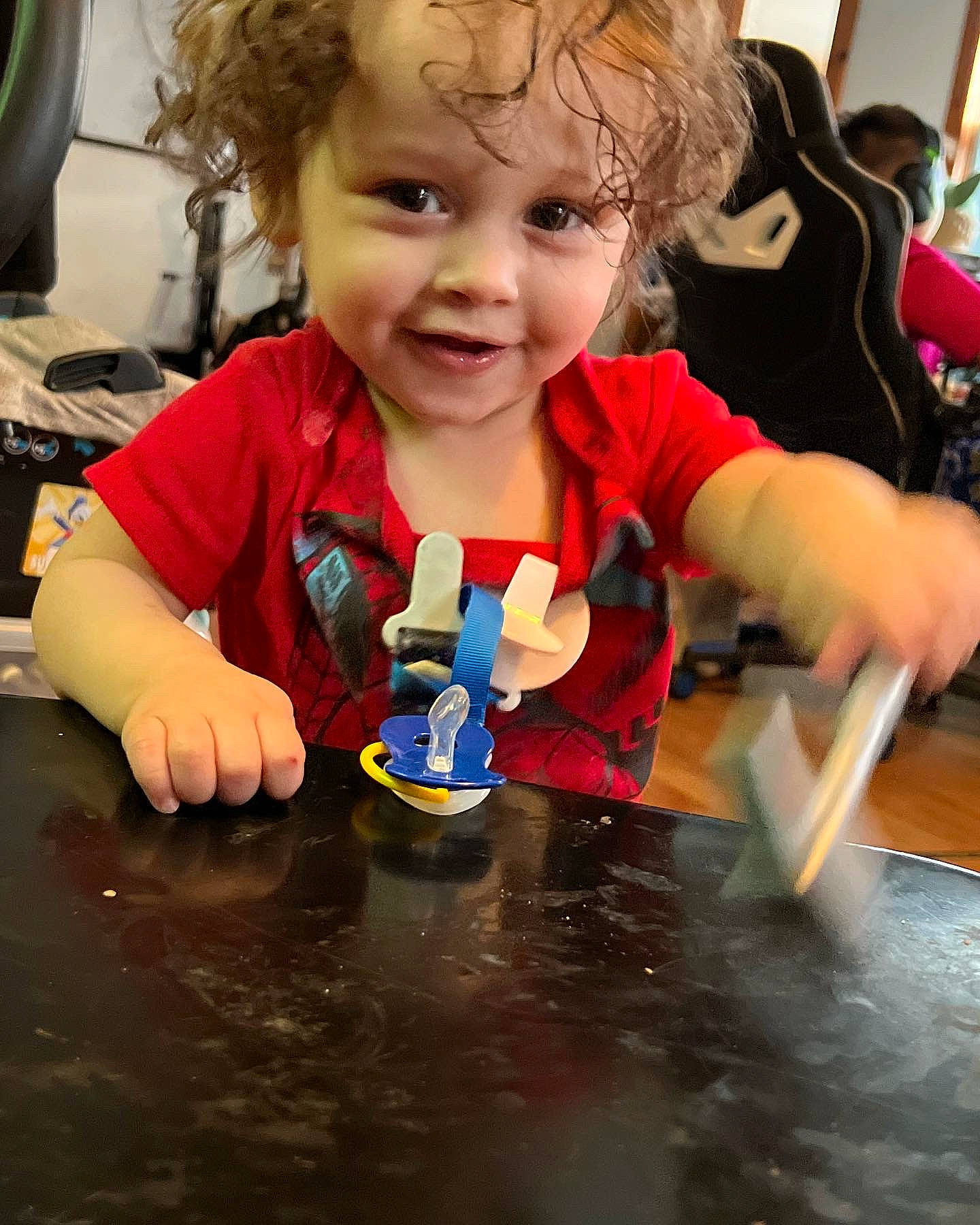 Brendan is registered to the contest to win money with this photo: baby, cheek, child, child_art, event, fictional_character, flooring, fun, hand, happy, kindergarten, learning, person, play, smile, t_shirt, table, toddler, toy, tree