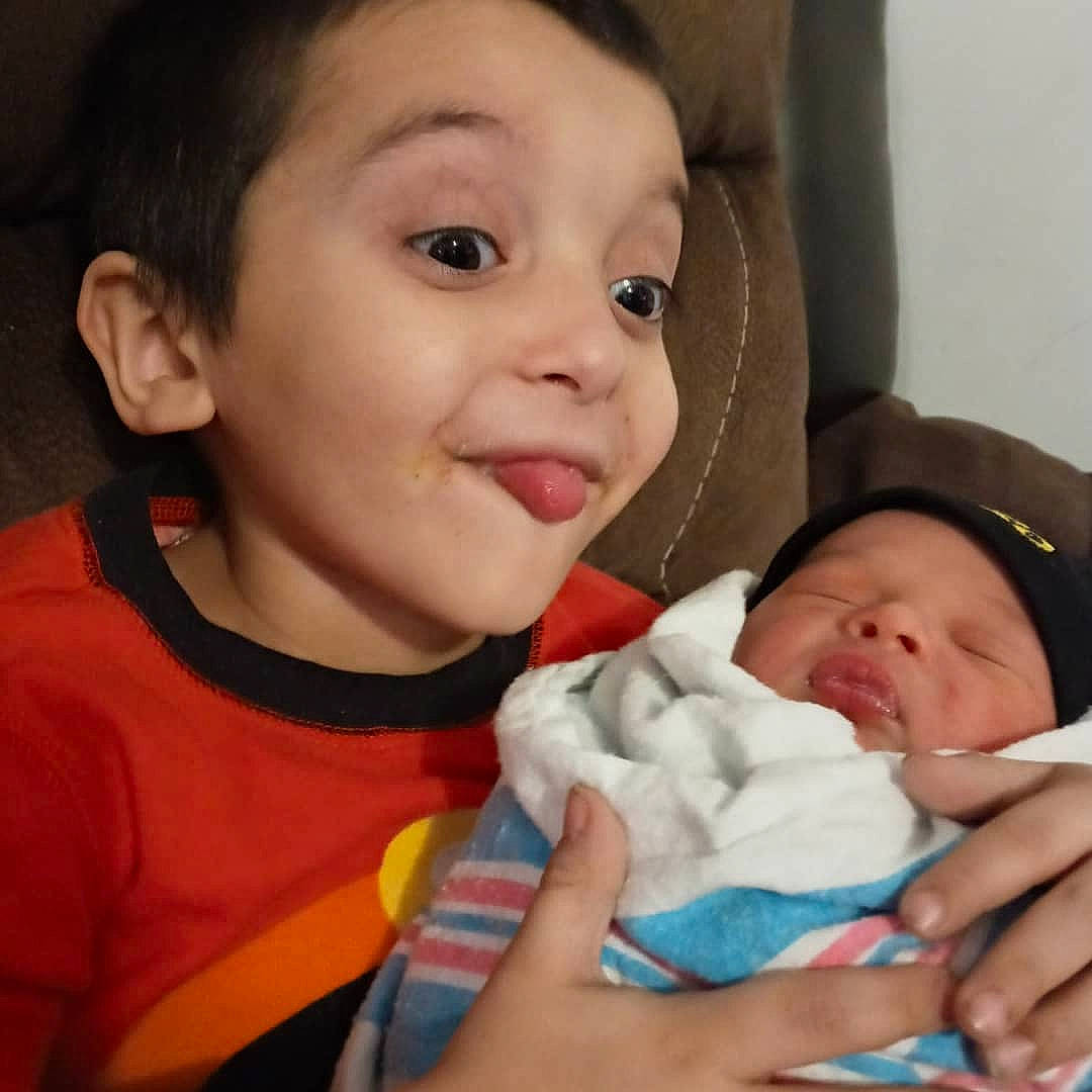 Alexander is registered to the contest to win money with this photo: baby, baby_toddler_clothing, cheek, chin, comfort, ear, eye, eyebrow, face, finger, gesture, hand, happy, iris, lip, mouth, nose, organ, person, skin