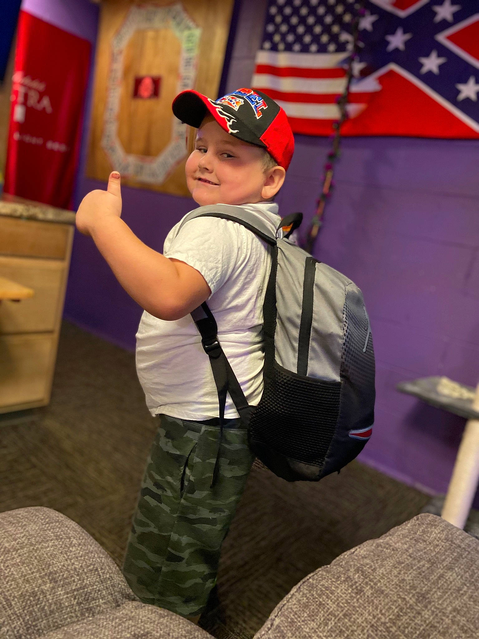 Chevy is registered to the contest to win money with this photo: child, fun, headwear, joy, neck, person, shoulder