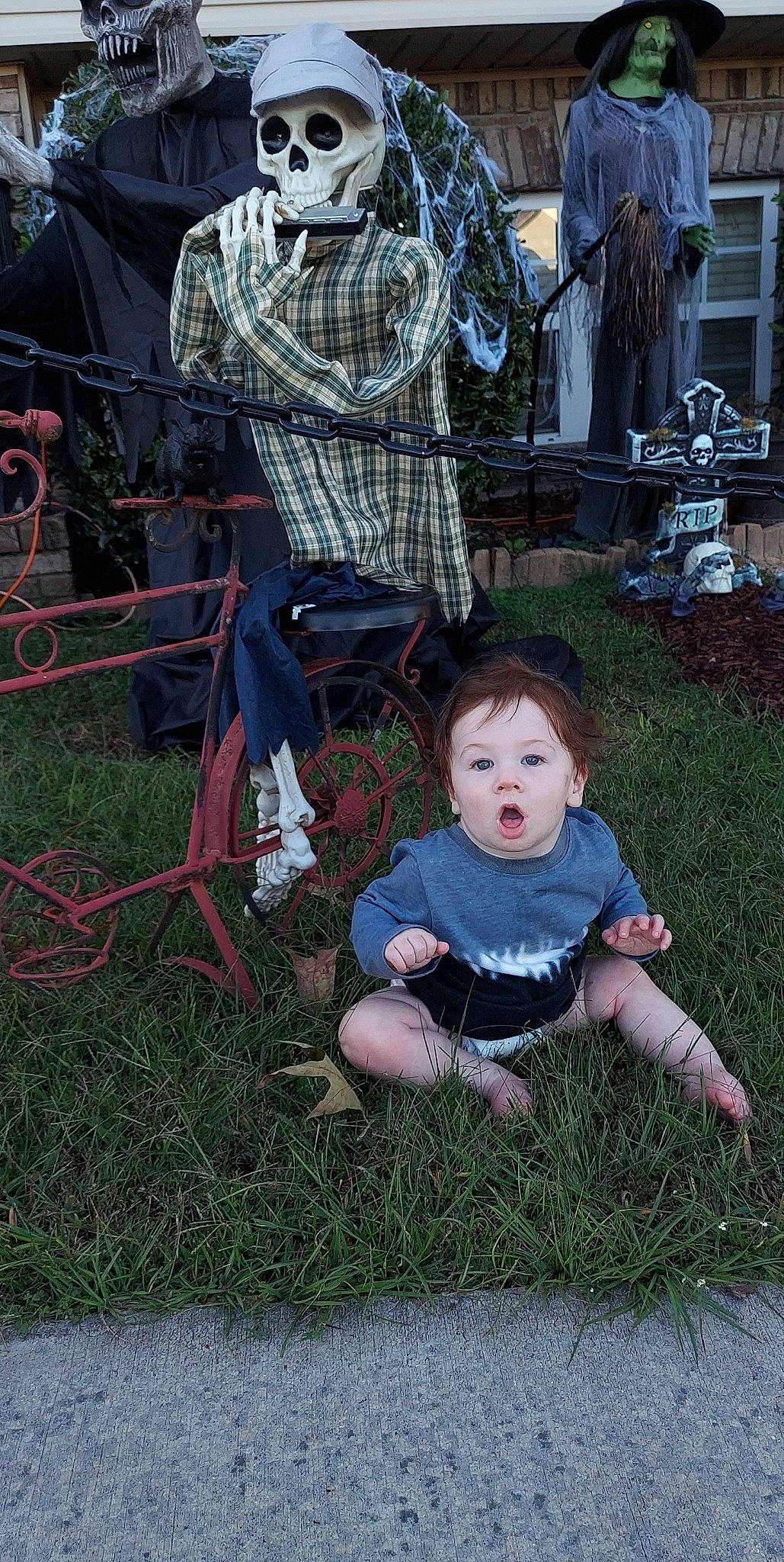 Gabriel is registered to the contest to win money with this photo: baby, baby_products, baby_toddler_clothing, backyard, chair, child, event, fun, garden, grass, lawn, leisure, pattern, person, plant, recreation, sitting, surprise, toddler, tree