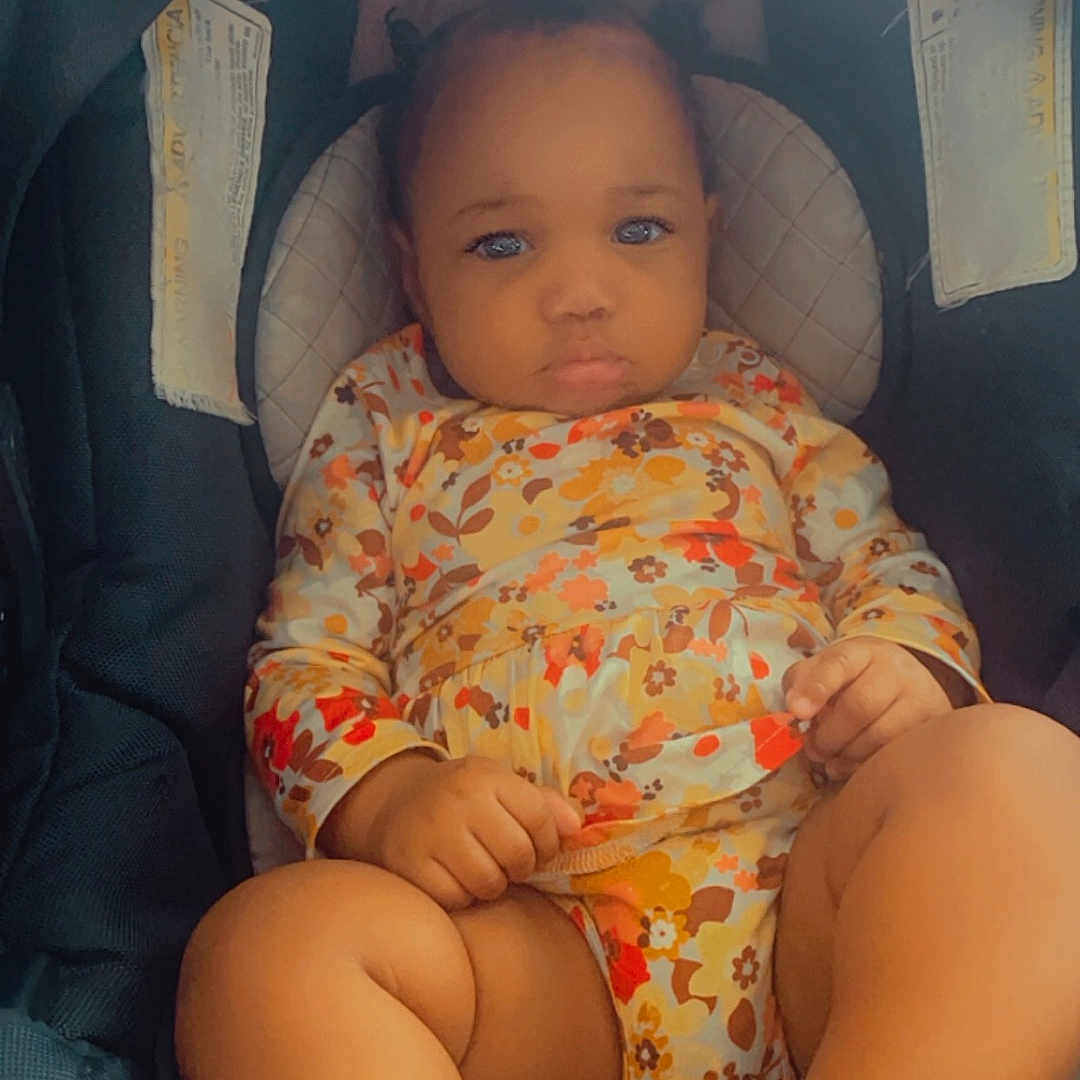 Kodance is registered to the contest to win money with this photo: baby, bed, clothing, cradle, crib, cushion, face, furniture, happy, hat, head, homedecor, infantbed, newborn, person, photography, portrait, sleeping, smile, t_shirt