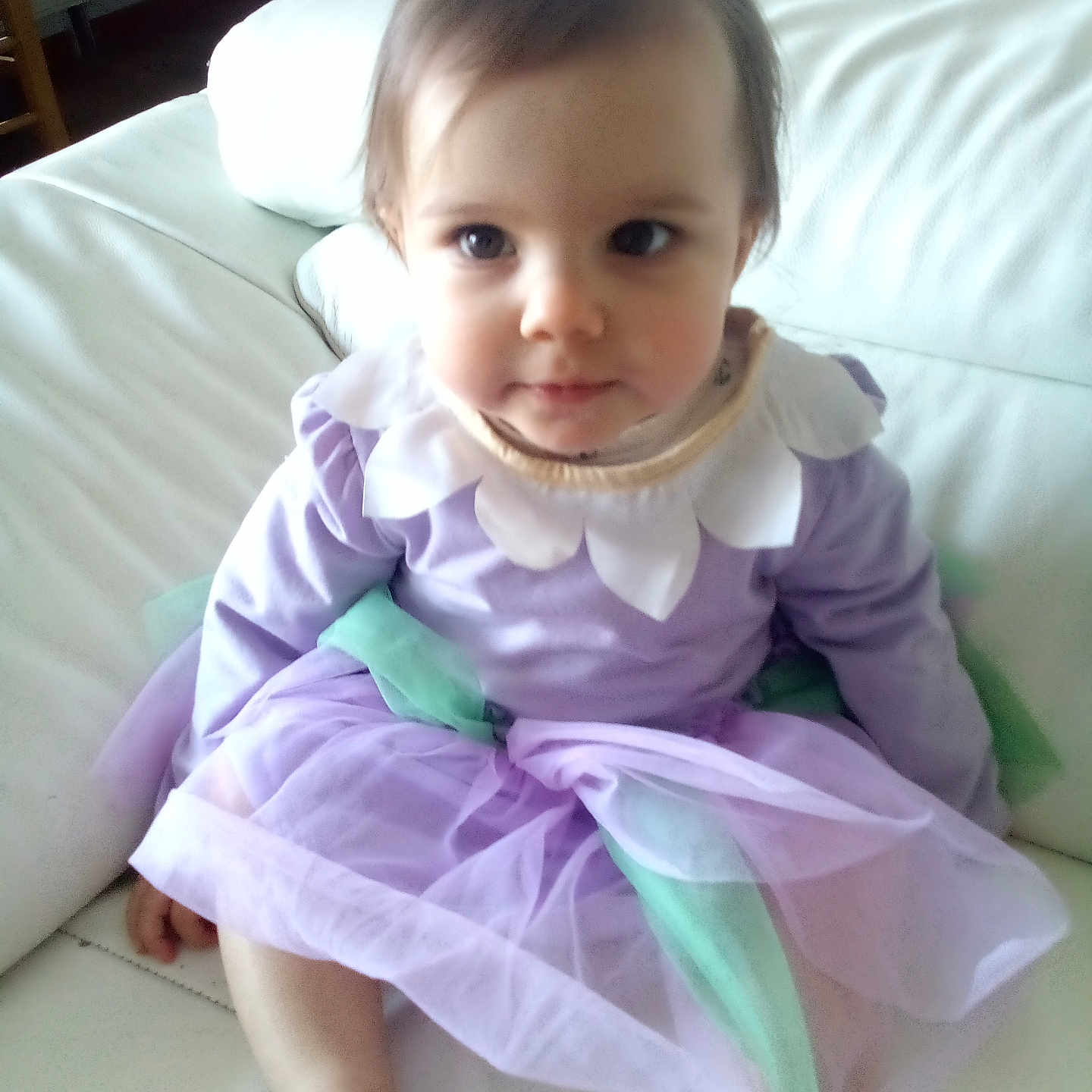 Emma participe au concours pour gagner de l'argent avec cette photo : accessories, baby, clothing, costume, couch, cushion, dress, face, formalwear, furniture, glove, head, homedecor, indoors, jewelry, necklace, person, photography, portrait, sitting