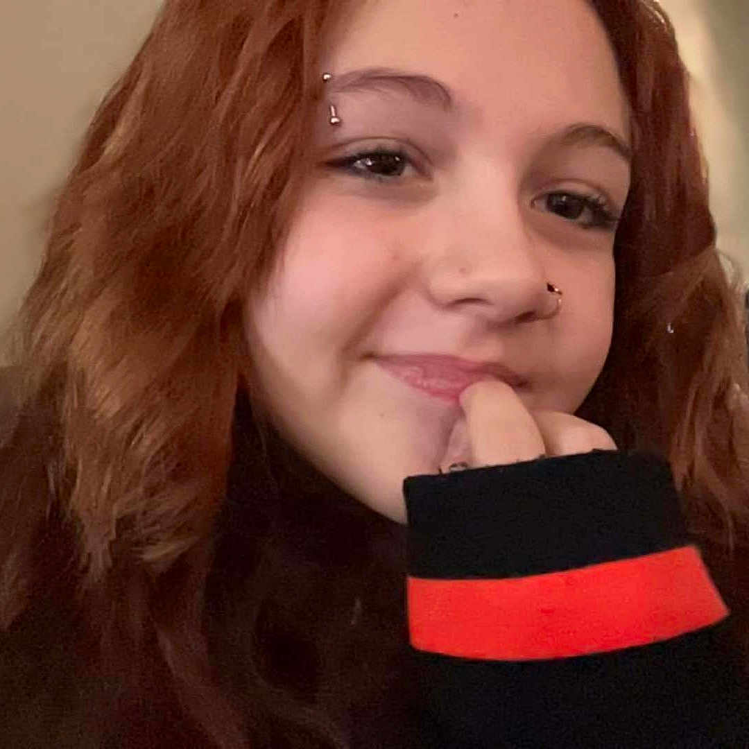 Callie is registered to the contest to win money with this photo: accessories, adult, bodypart, brownhair, cosmetics, dimples, face, female, finger, hand, happy, head, lipstick, person, photography, portrait, selfie, smile, wallet, woman