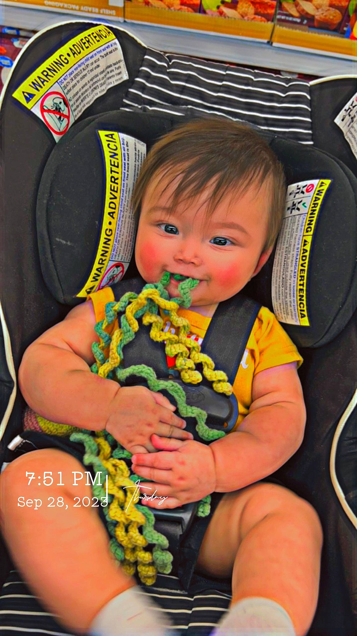 Divine is registered to the contest to win money with this photo: arm, baby, baby_carriage, baby_products, car_seat, chair, child, comfort, fashion_accessory, fun, hand, happy, iris, lap, nail, person, play, sitting, toddler, toy