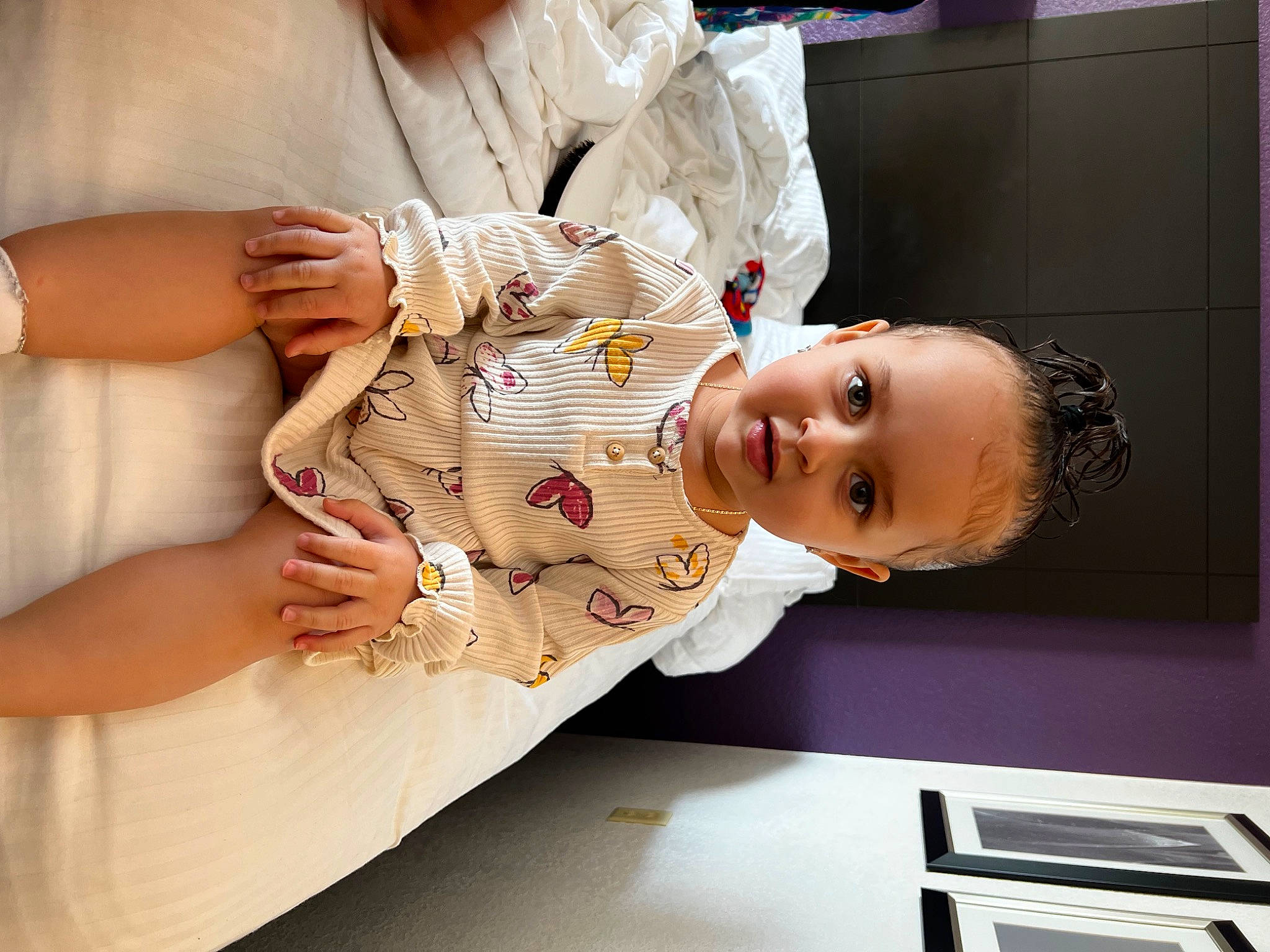 Amyla is registered to the contest to win money with this photo: abdomen, baby, baby_products, baby_toddler_clothing, child, comfort, elbow, fashion_design, finger, happy, human_body, human_leg, nail, person, room, sleeve, thigh, toddler, white, wood