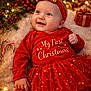 baby, infant, child, smiling, red_outfit, holiday, christmas, christmas_tree, headband, bow, gift, candy_canes, fairy_lights, ornaments, festive, blanket, portrait, happy, sparkle, closeup
