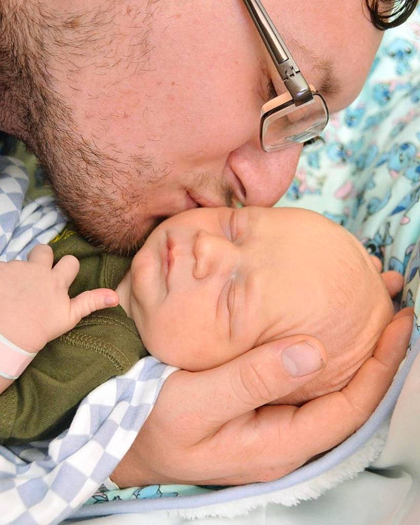 Chase is registered to the contest to win money with this photo: baby, cheek, chin, comfort, ear, eyebrow, eyelash, eyewear, finger, forehead, gesture, happy, interaction, lip, mouth, neck, nose, person, skin, vision_care