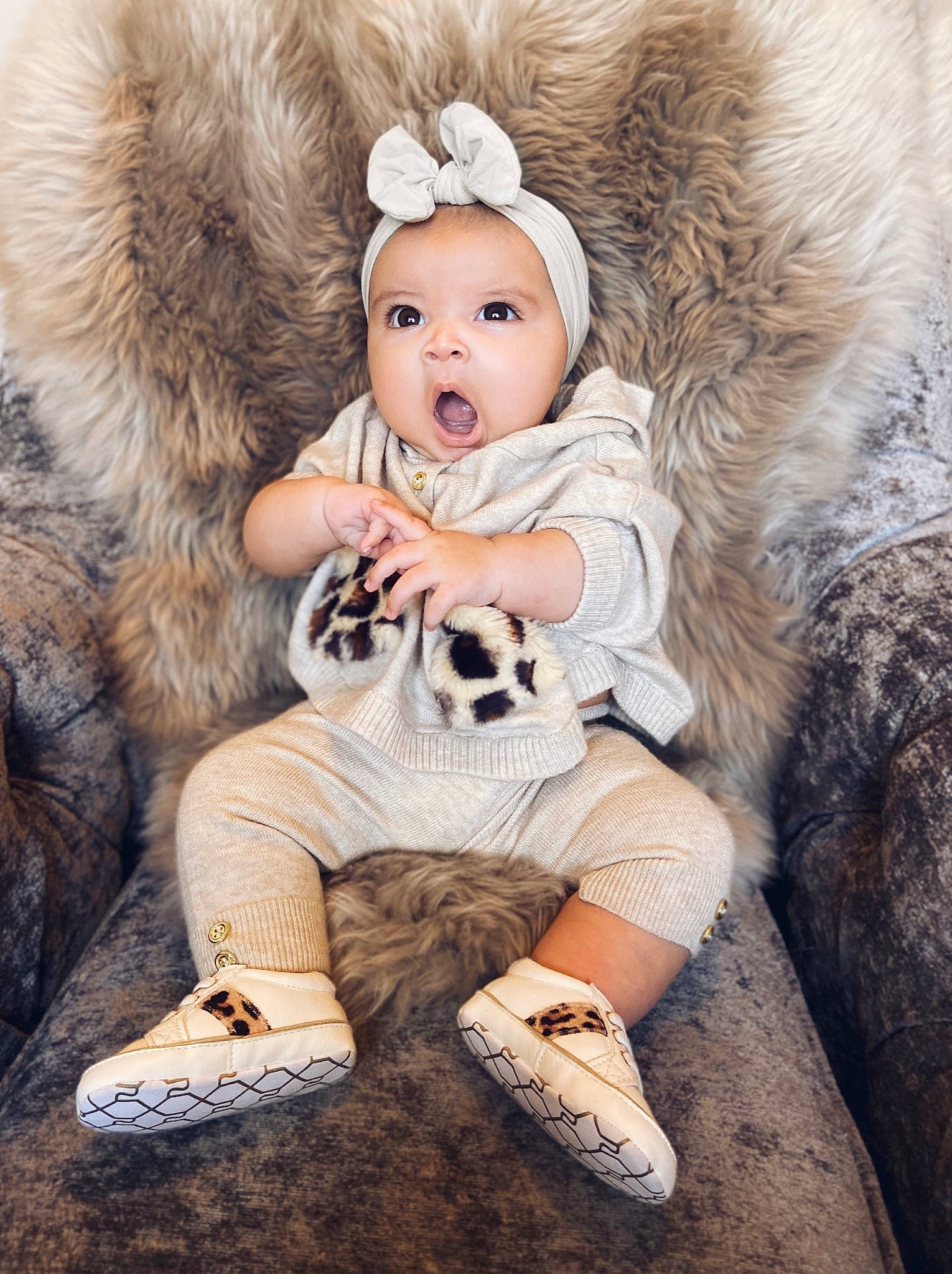Inez is registered to the contest to win money with this photo: baby, child, child_model, fur, fur_clothing, headgear, outerwear, person, photograph, photography, portrait, skin, toddler