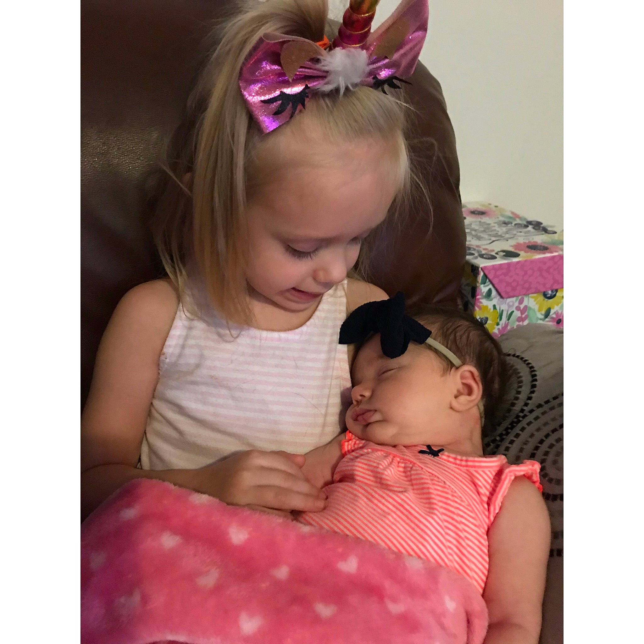 Sophia is registered to the contest to win money with this photo: baby, brown_hair, child, ear, fashion_accessory, hair_accessory, hair_tie, head, headband, headgear, headpiece, neck, pattern, person, pink, play, polka_dot, product, toddler