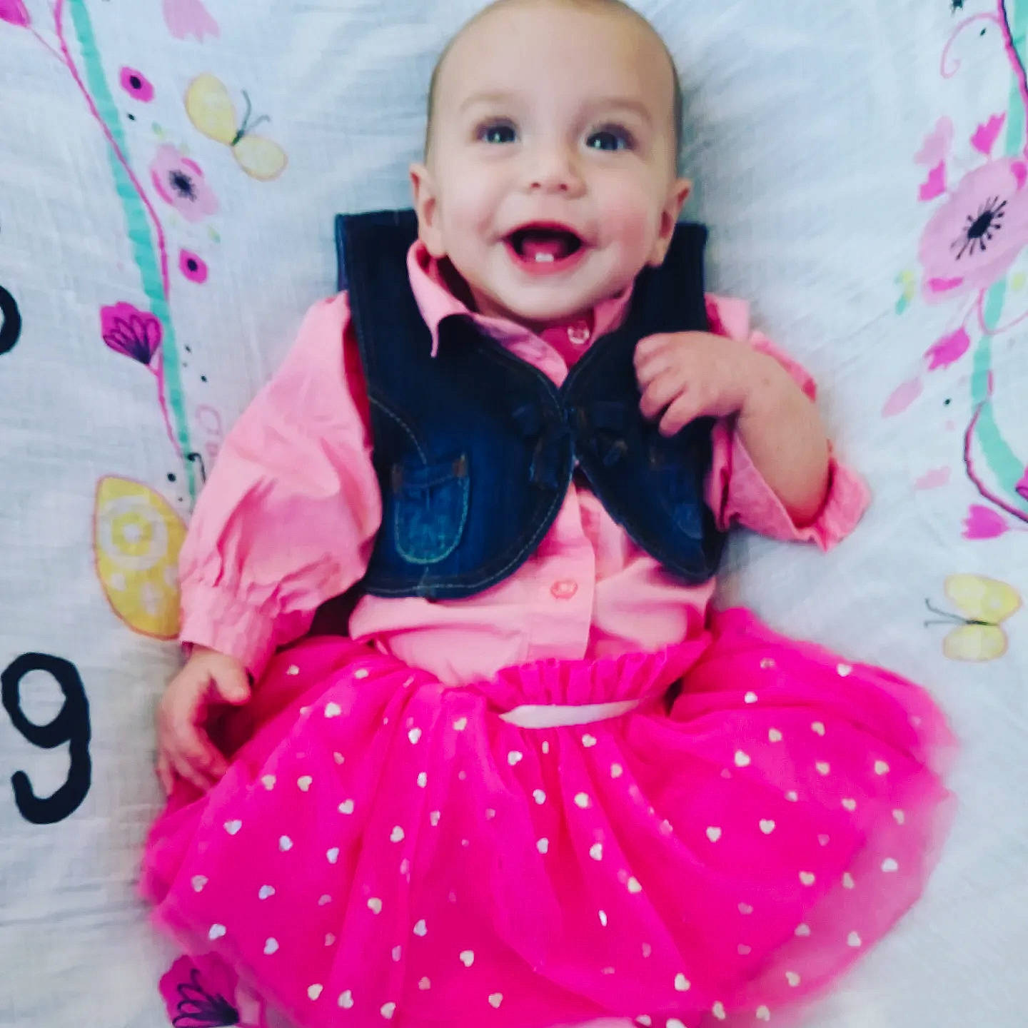 June joined the competition — help win amazing prizes! baby, baby_products, baby_toddler_clothing, child, dress, face, fun, happy, magenta, pattern, person, pink, product, purple, sitting, skin, sleeve, smile, textile, toddler