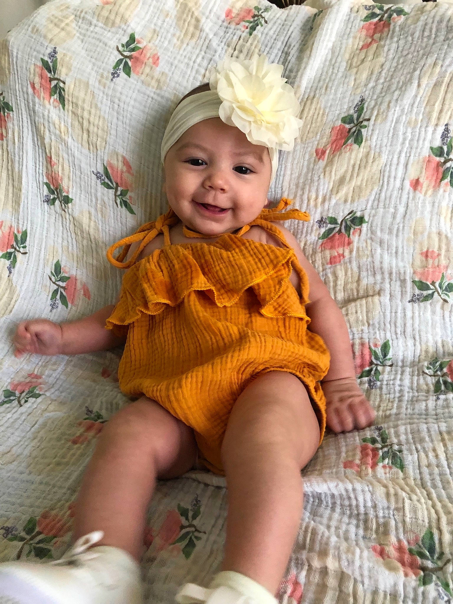 Aura is registered to the contest to win money with this photo: baby, blond, child, child_model, clothing, fashion_accessory, fawn, headgear, joy, knit_cap, pattern, person, sitting, skin, sleeve, smile, toddler, yellow