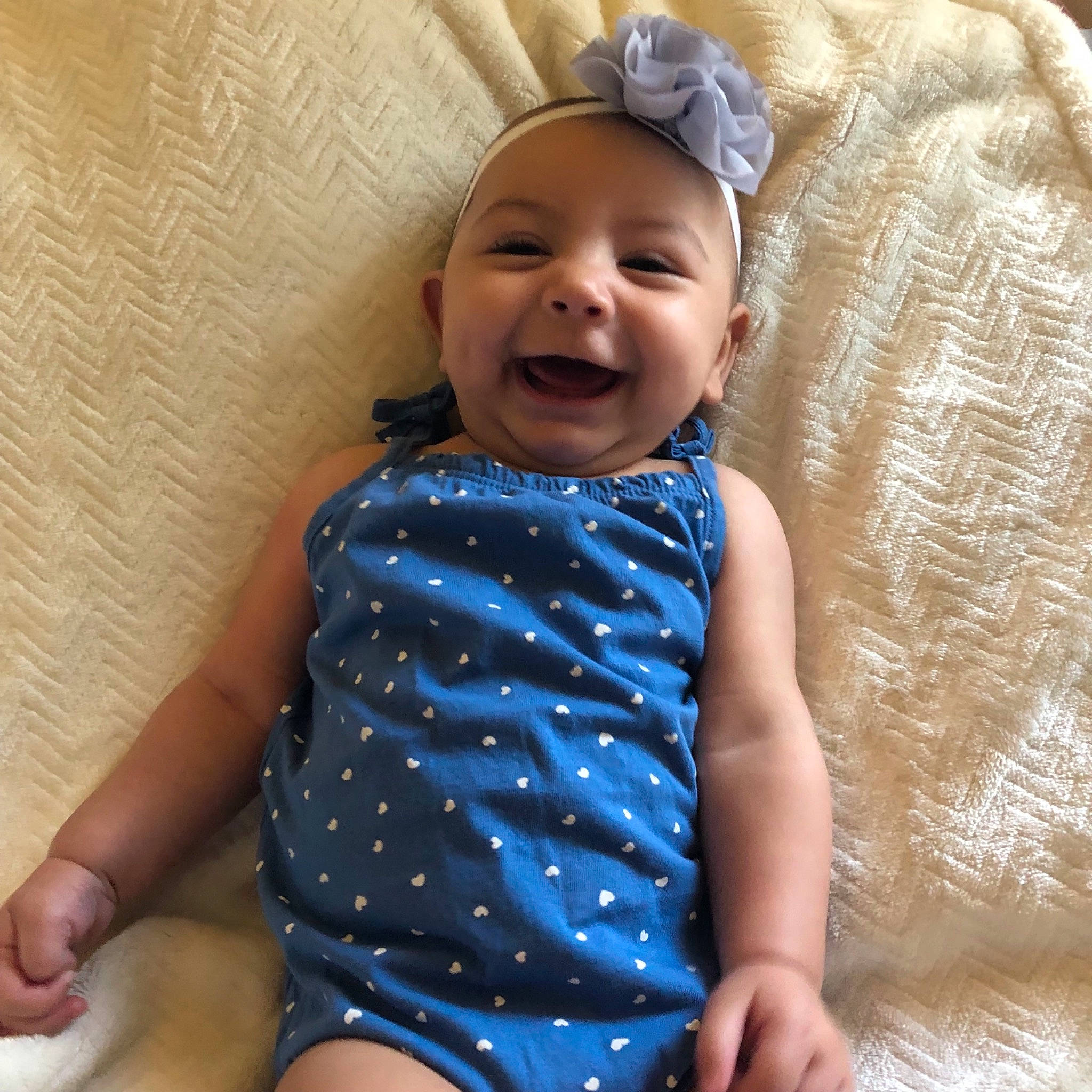 Aura is registered to the contest to win money with this photo: baby, baby_laughing, baby_products, baby_toddler_clothing, blue, child, facial_expression, happy, head, headgear, laugh, pattern, person, product, sleeve, smile, toddler