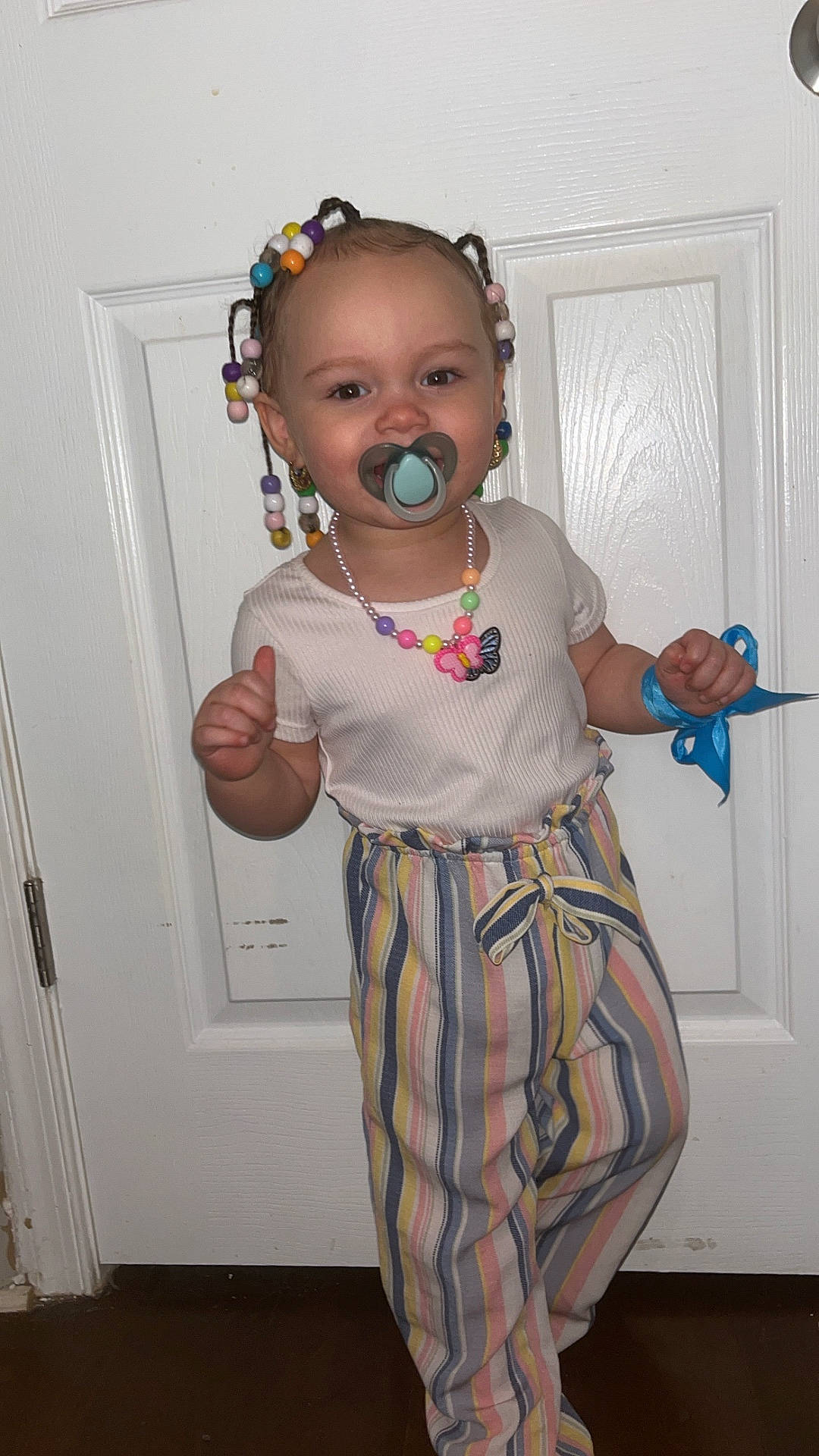 Noelle joined the competition — help win amazing prizes! accessories, baby, bodypart, clothing, cutlery, door, earbuds, electronics, face, finger, hand, head, jewelry, necklace, pants, person, photography, portrait, spoon, wood