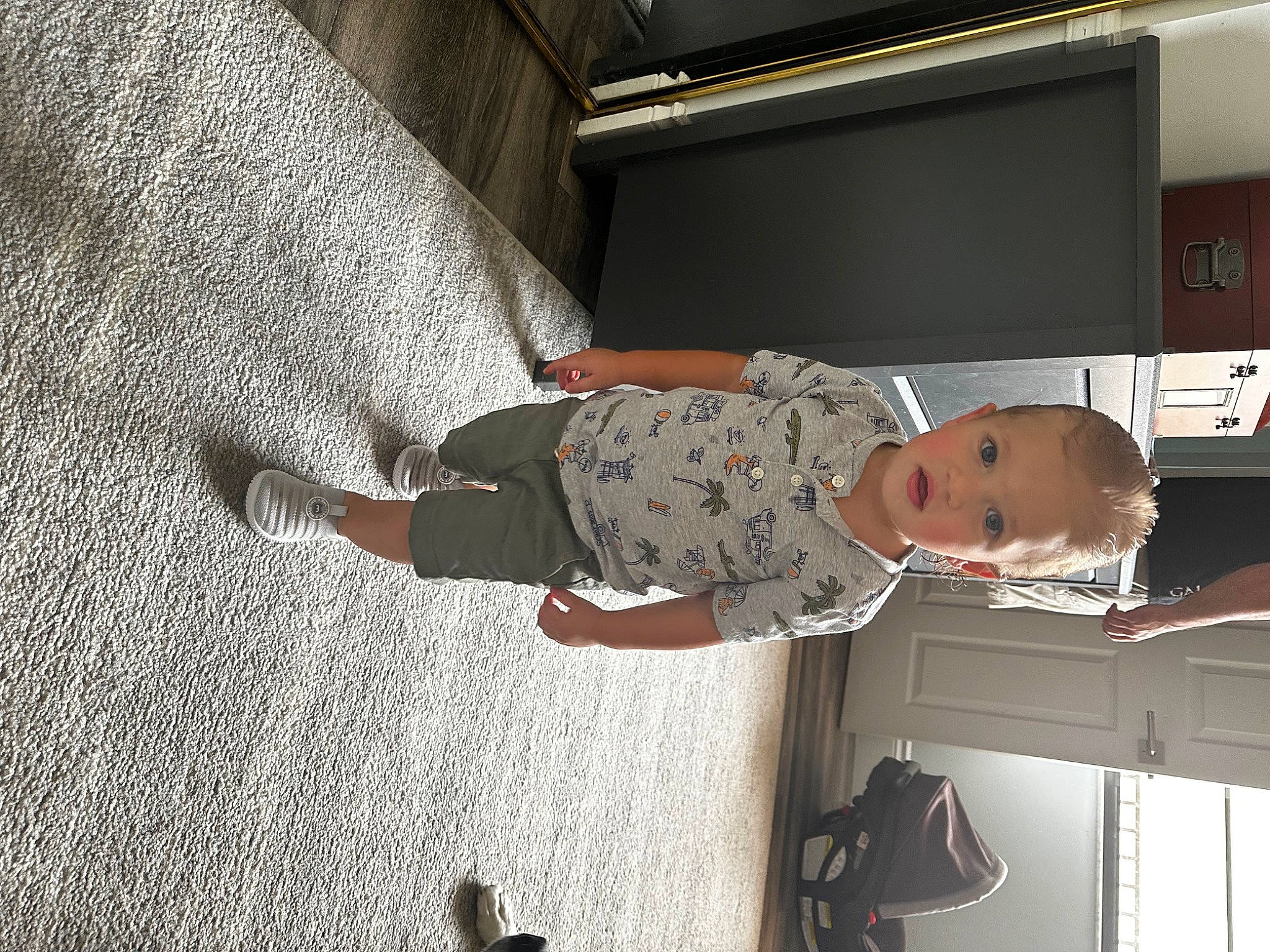 Colton is registered to the contest to win money with this photo: ceiling, child, comfort, concrete, elbow, flooring, military, military_camouflage, military_organization, military_person, person, room, shadow, soldier, toddler, wood