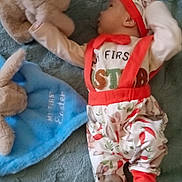 Phoenix joined the competition — help win amazing prizes! baby, baby_clothes, blanket, blue, bunny, child, cute, easter, floor, headwear, holiday, infant, lying_down, outfit, patterned_pants, plush_toy, reaching, soft_toy, teal, wooden_floor