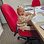 carpet, child, clothing, desk, furniture, hair_buns, happy, indoor, office_chair, paper, pen, person, red_chair, room, smiling, sweater, toddler, window, workspace, writing