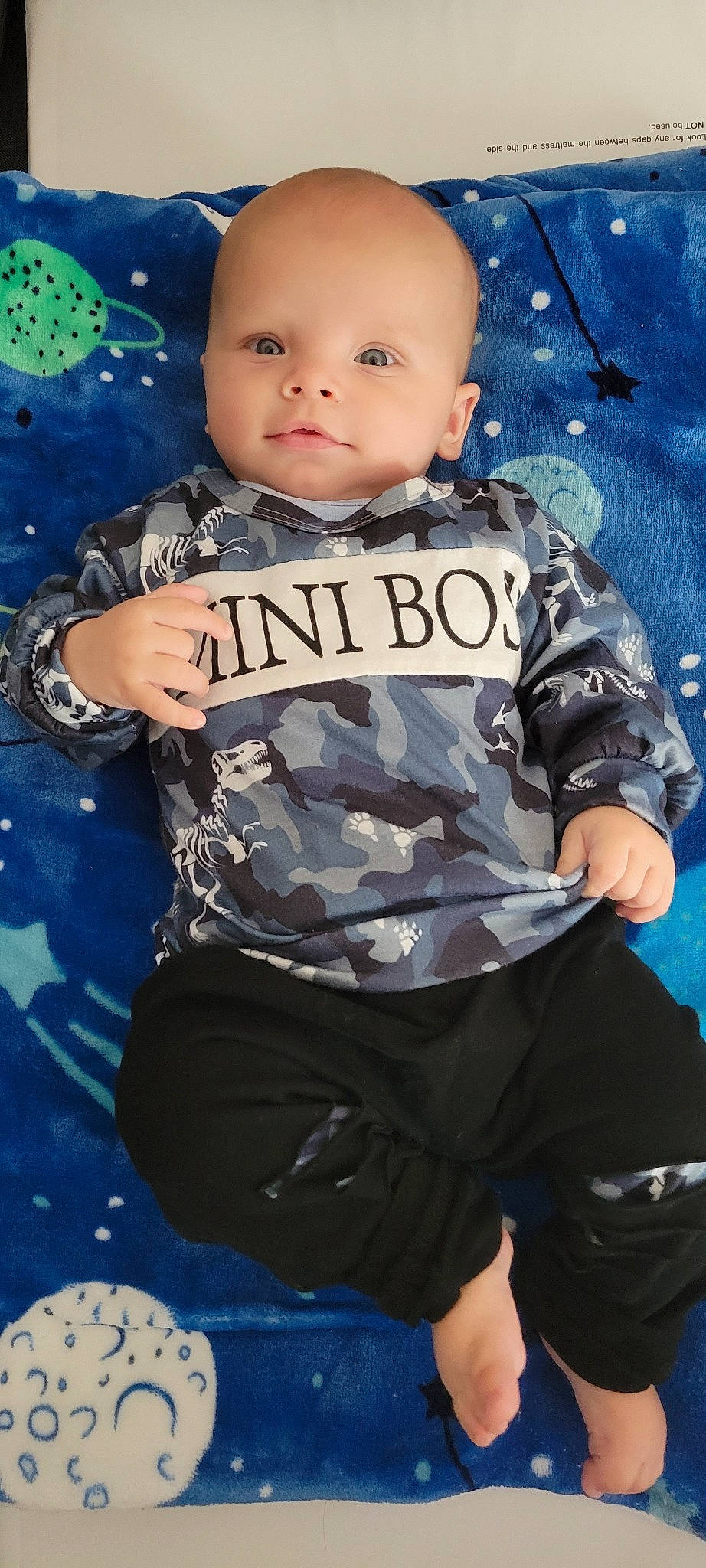 Zayden joined the competition — help win amazing prizes! baby, baby_toddler_clothing, blue, cheek, child, cool, electric_blue, facial_expression, flash_photography, fun, gesture, happy, logo, pattern, person, sleeve, standing, t_shirt, thigh, toddler