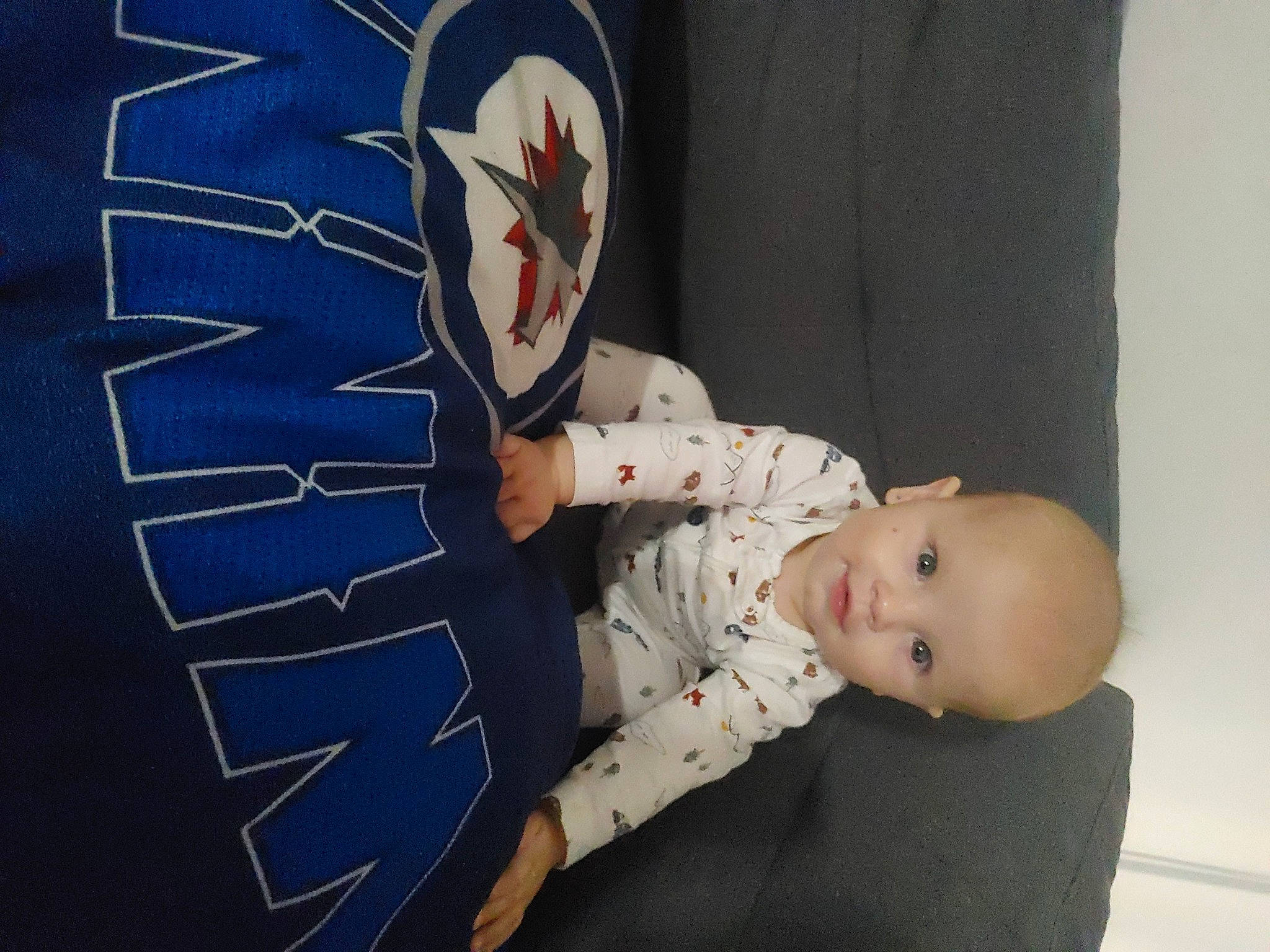 Zayden is registered to the contest to win money with this photo: arm, baby, baby_toddler_clothing, carmine, child, comfort, elbow, electric_blue, flag_of_the_united_states, flash_photography, foot, happy, headgear, linens, pattern, person, sitting, sleeve, smile, toddler