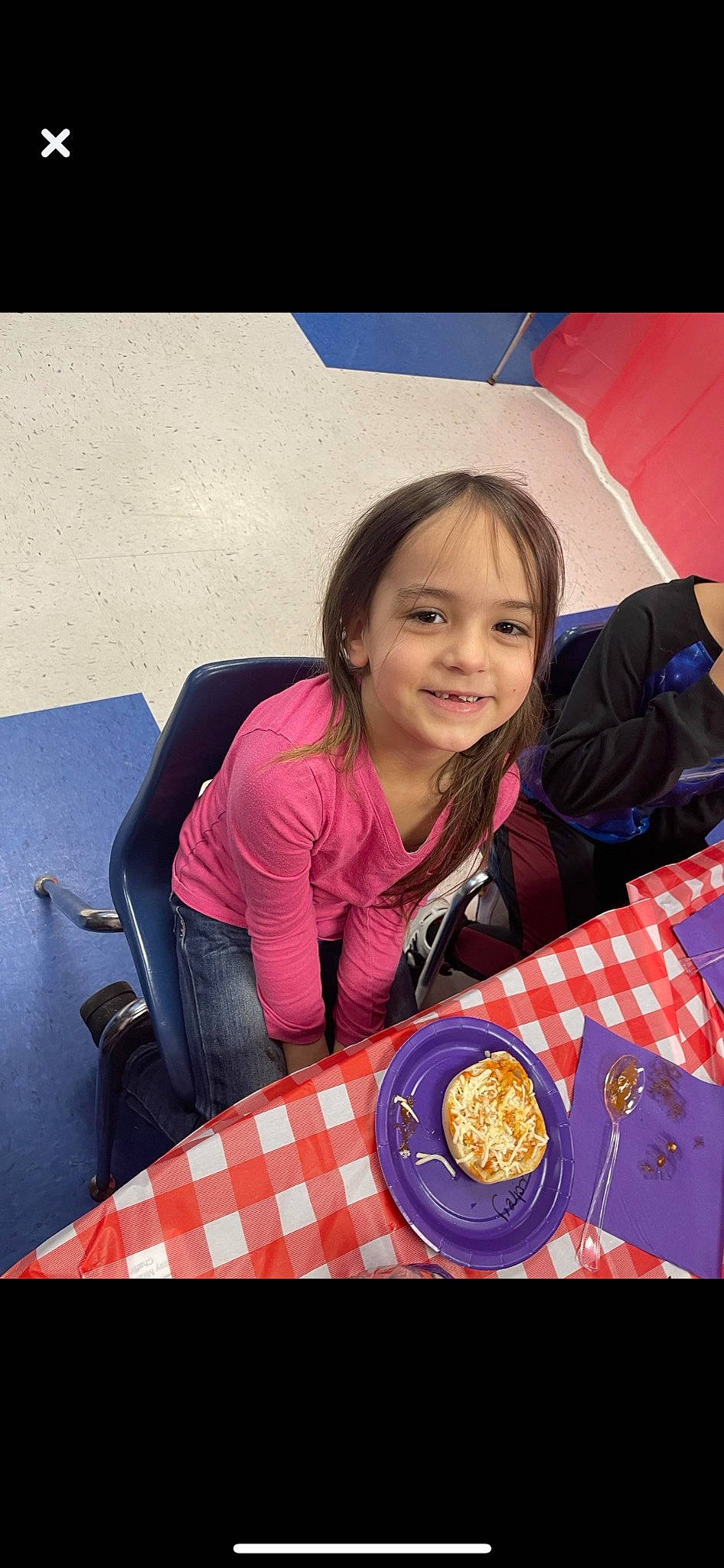 Audrey is registered to the contest to win money with this photo: chair, child, comfort_food, cuisine, dish, food, fun, happy, jacket, joy, pattern, person, plate, recreation, sitting, sleeve, smile, sweetness, t_shirt, table