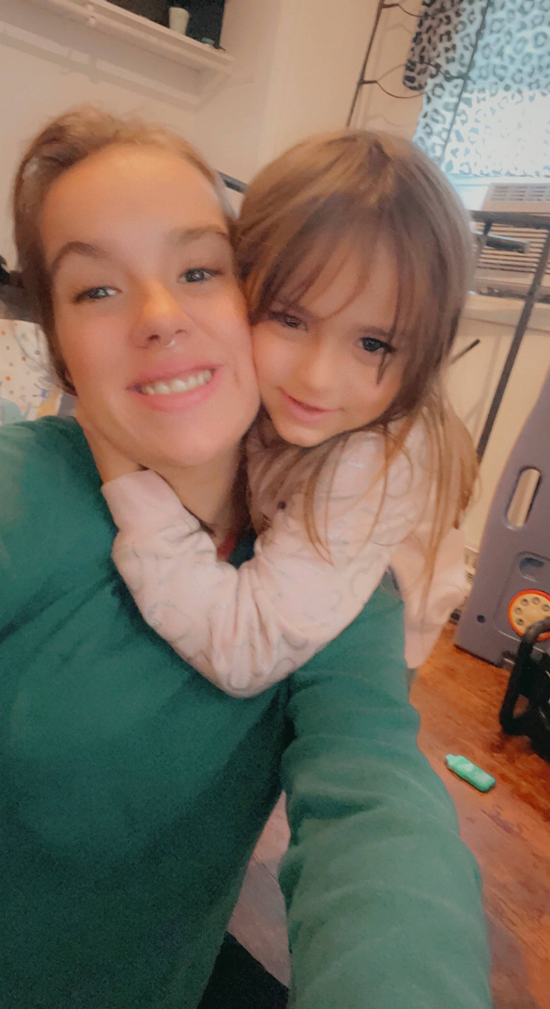 Audrey is registered to the contest to win money with this photo: blond, brown_hair, cheek, child, event, fun, gesture, hair, happy, hug, iris, joy, leisure, lip, long_hair, nose, person, selfie, sitting, skin