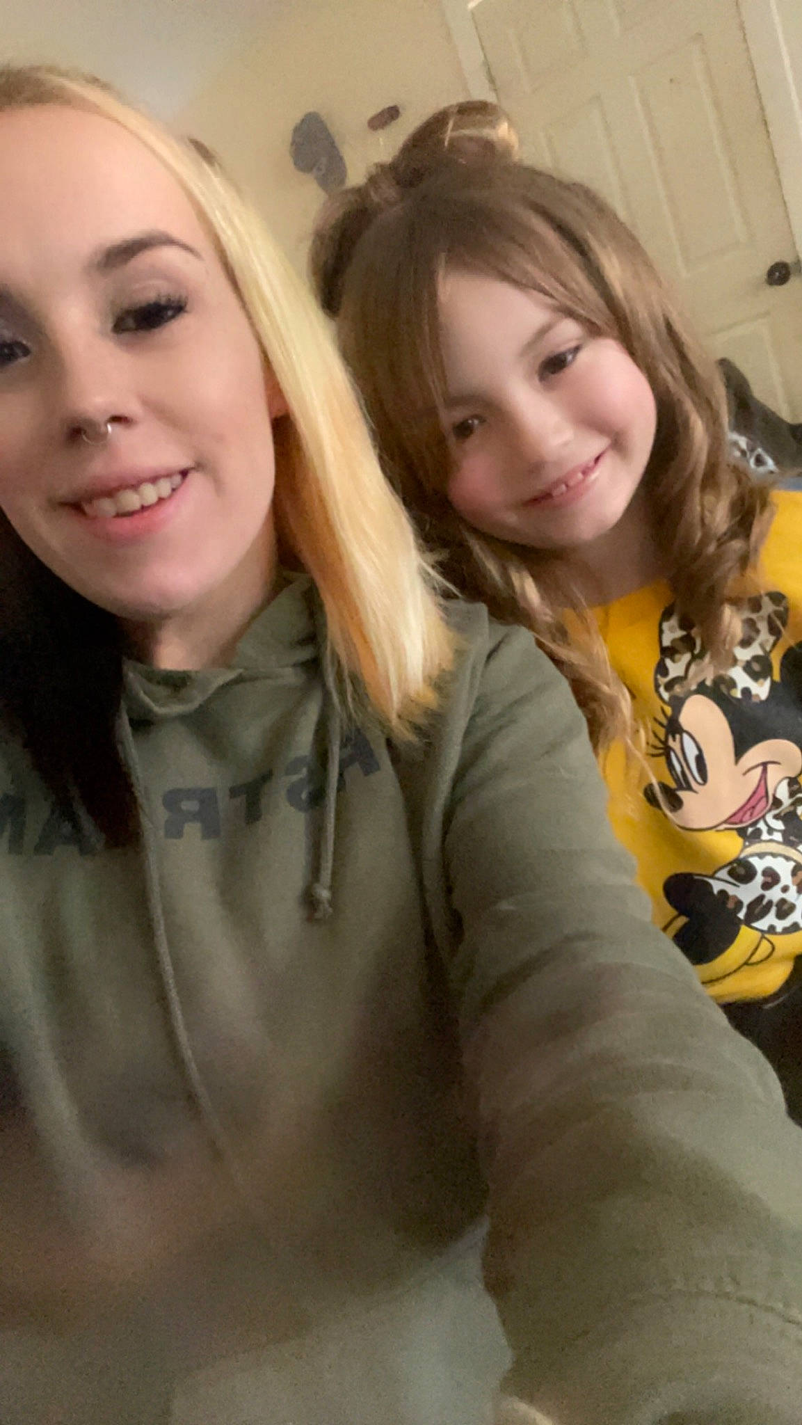 Aaliyah is registered to the contest to win money with this photo: black_hair, blond, cheek, event, eye, eyelash, face, friendship, gesture, happy, iris, joy, layered_hair, lip, long_hair, mouth, nose, outerwear, person, selfie