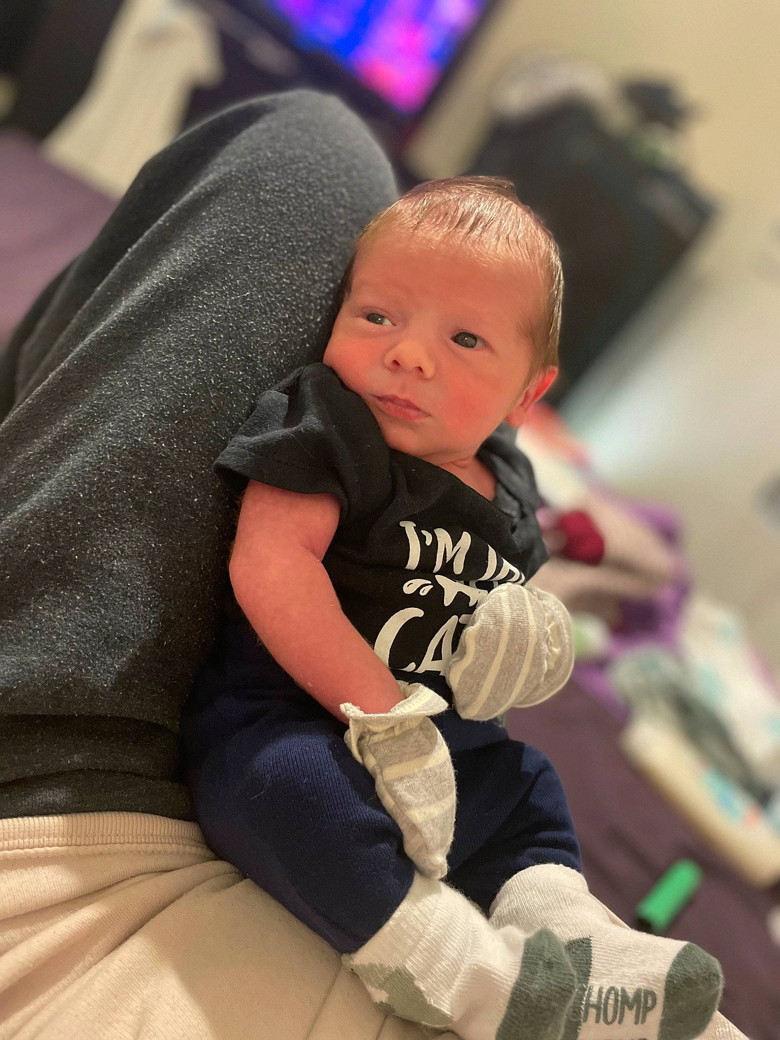 Justin joined the competition — help win amazing prizes! abdomen, baby, baby_toddler_clothing, child, comfort, elbow, finger, flooring, fun, happy, human_body, human_leg, knee, lap, person, room, sitting, sock, t_shirt, thigh