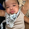 Zyhir is registered to the contest to win money with this photo: arm, baby, blanket, closeup, clothing, comfort, cute, dog, expression, face, hair, indoors, infant, pacifier, person, pet, resting, skin, sleeping_dog, striped