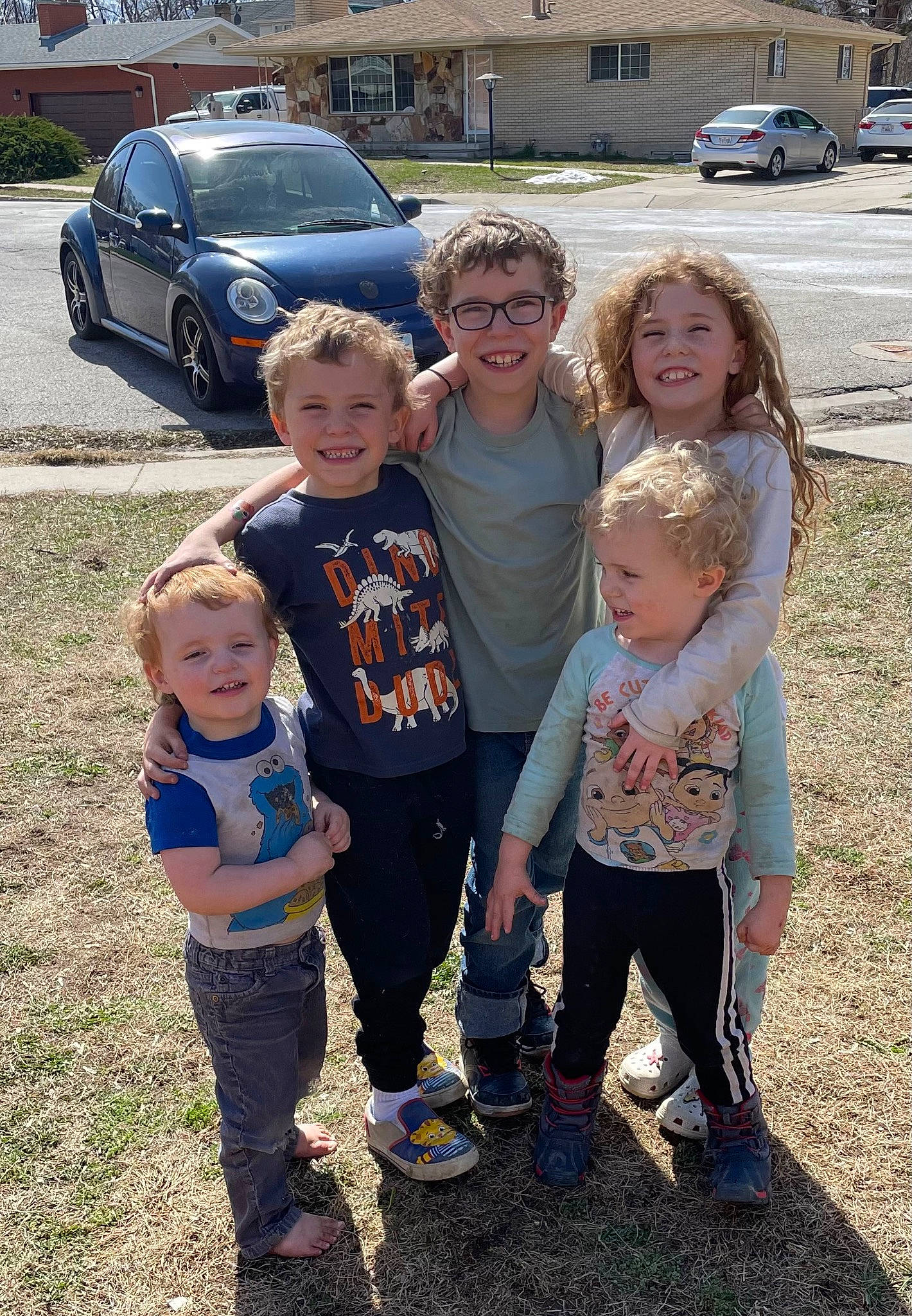 Mckynlie is registered to the contest to win money with this photo: asphalt, car, facial_expression, fun, grass, hairstyle, happy, joy, land_vehicle, motor_vehicle, person, plant, product, shoe, smile, t_shirt, tire, toddler, tree, vehicle